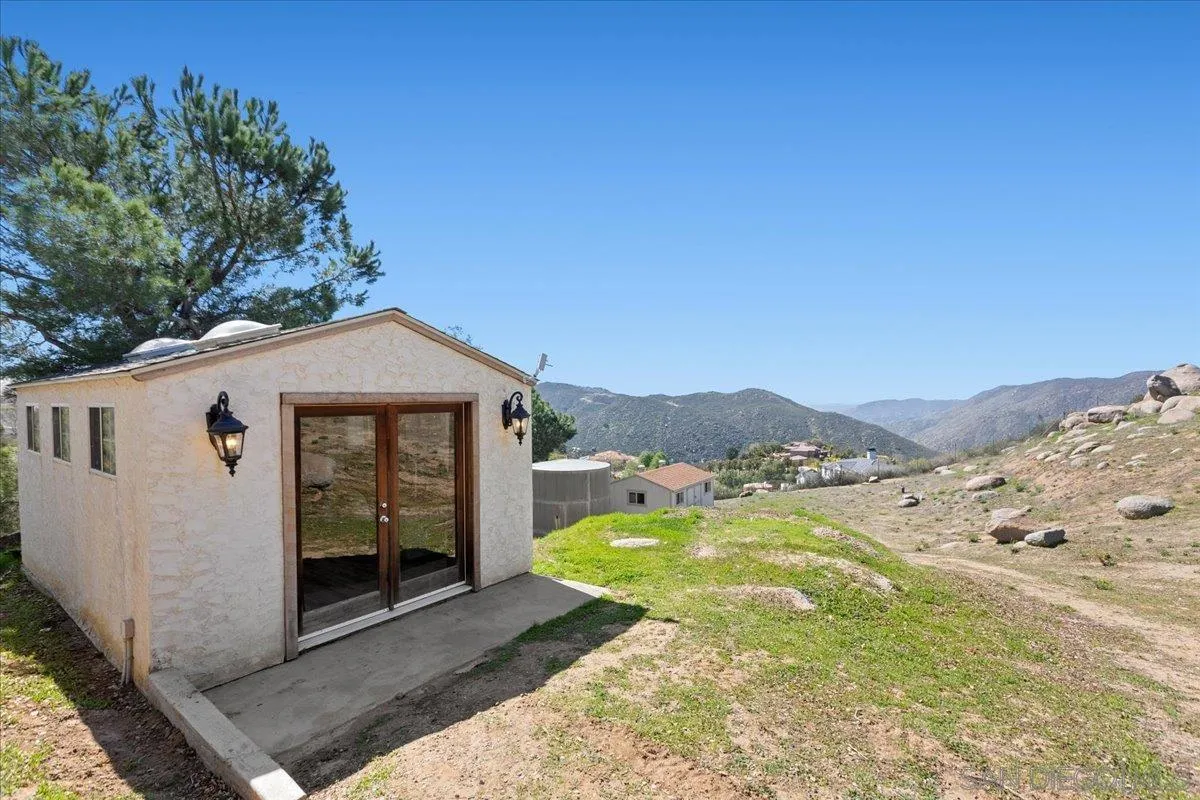 20403 Rancho Villa Road Ramona, CA 92065 - Photo 51 of 66 a view of a house with a yard and a tree