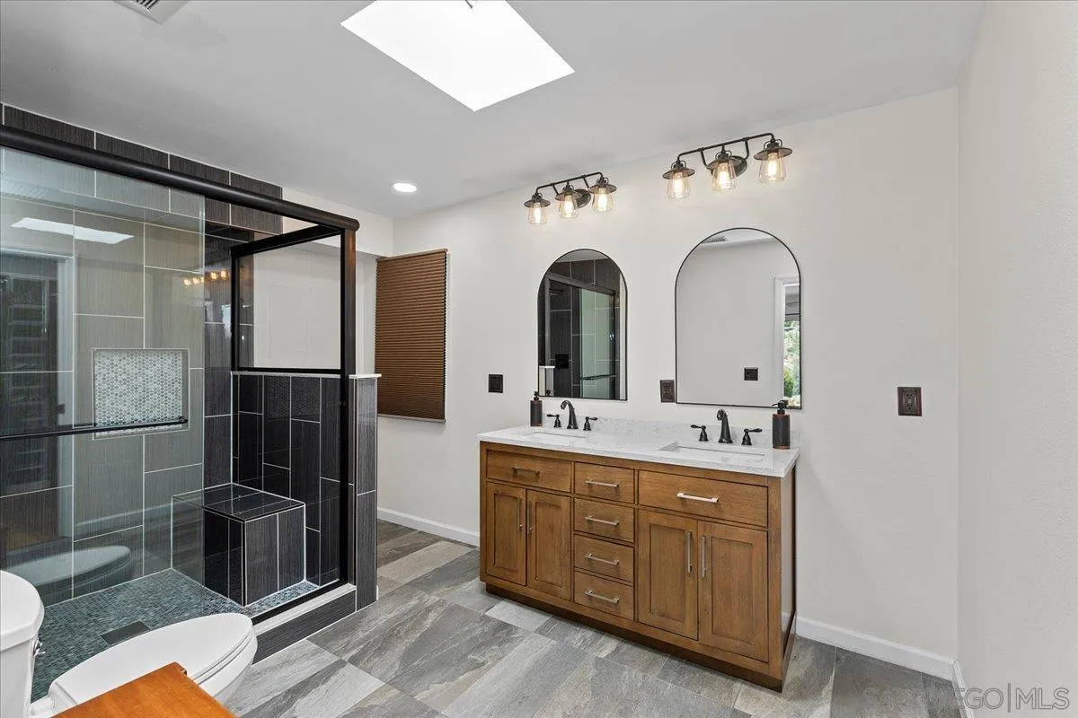 20403 Rancho Villa Road Ramona, CA 92065 - Photo 10 of 66 a bathroom with a double vanity sink mirror and shower