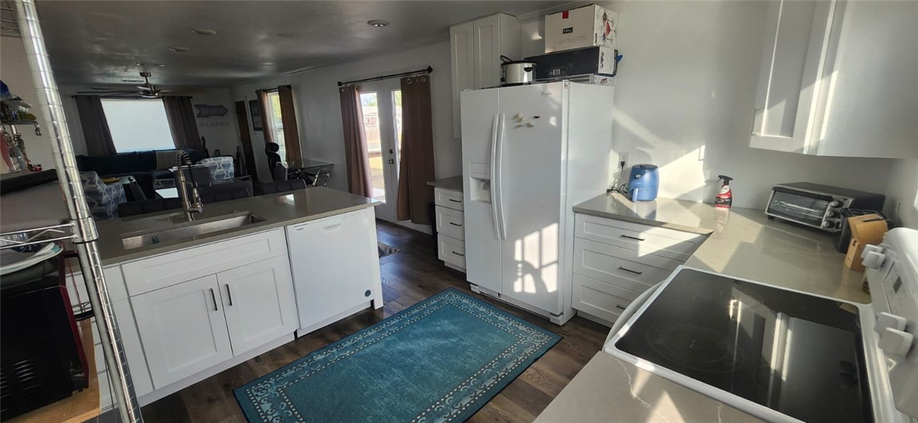 1407 Dema Street Corpus Christi, TX 78418 - Photo 14 of 19 a kitchen with a sink appliances and cabinets