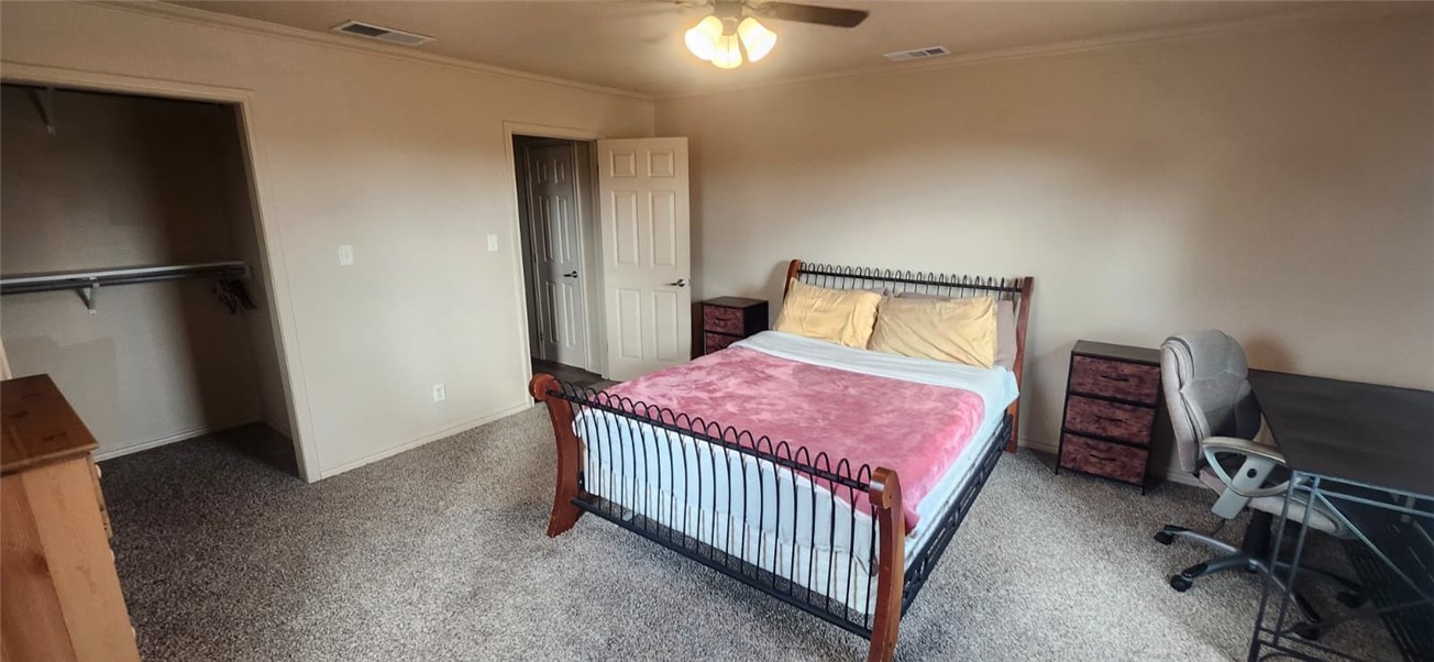 1407 Dema Street Corpus Christi, TX 78418 - Photo 16 of 19 a bedroom with a bed and a desk