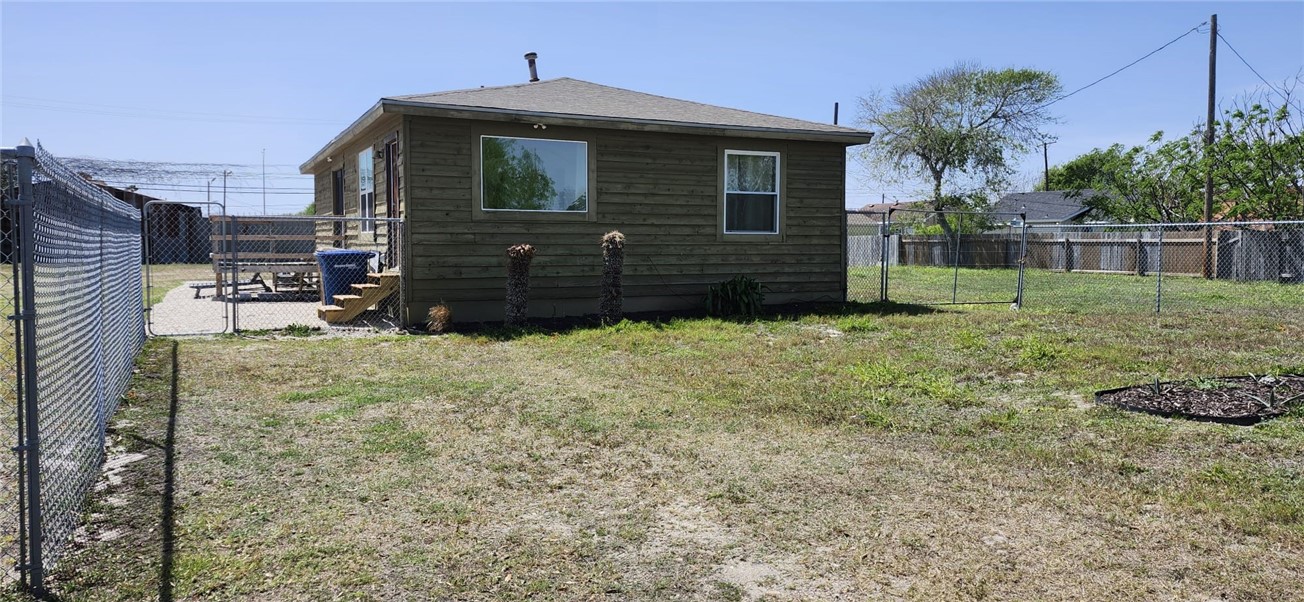 1407 Dema Street Corpus Christi, TX 78418 - Photo 2 of 19 a view of a house with a yard