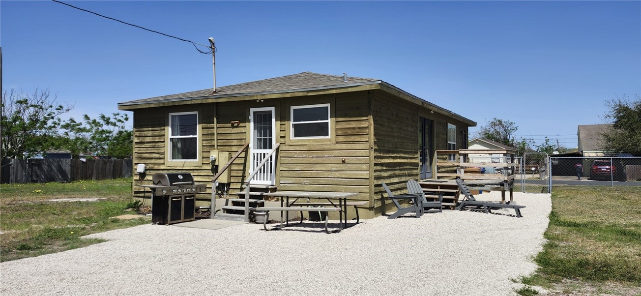 1407 Dema Street Corpus Christi, TX 78418 - Photo 4 of 19 a front view of a house with a yard