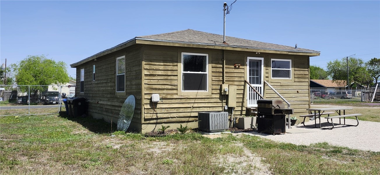 1407 Dema Street Corpus Christi, TX 78418 - Photo 6 of 19 a front view of a house with a yard