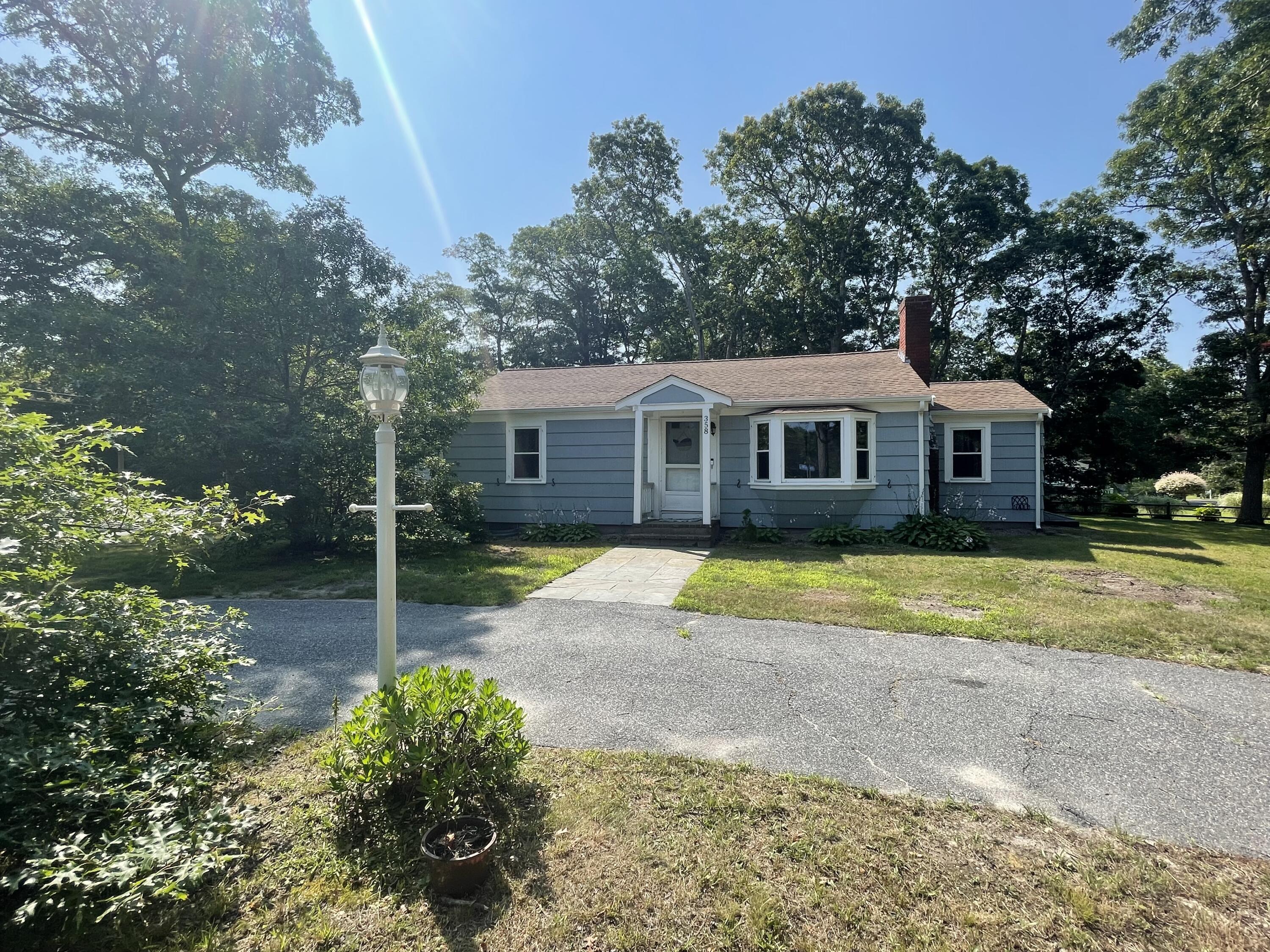 a view of a house with a backyard