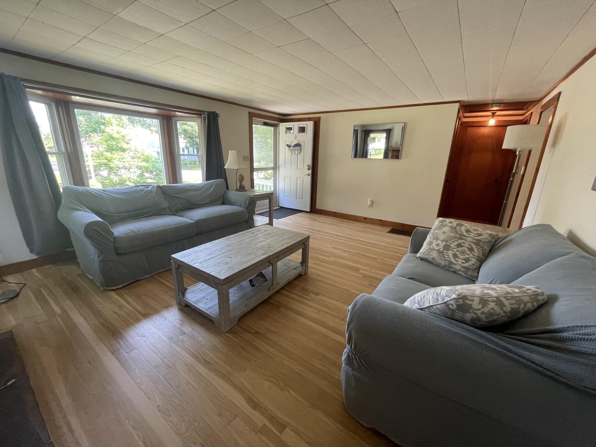 358 Strawberry Hill Road Centerville, MA 02632 - Photo 6 of 11 a living room with furniture and a large window