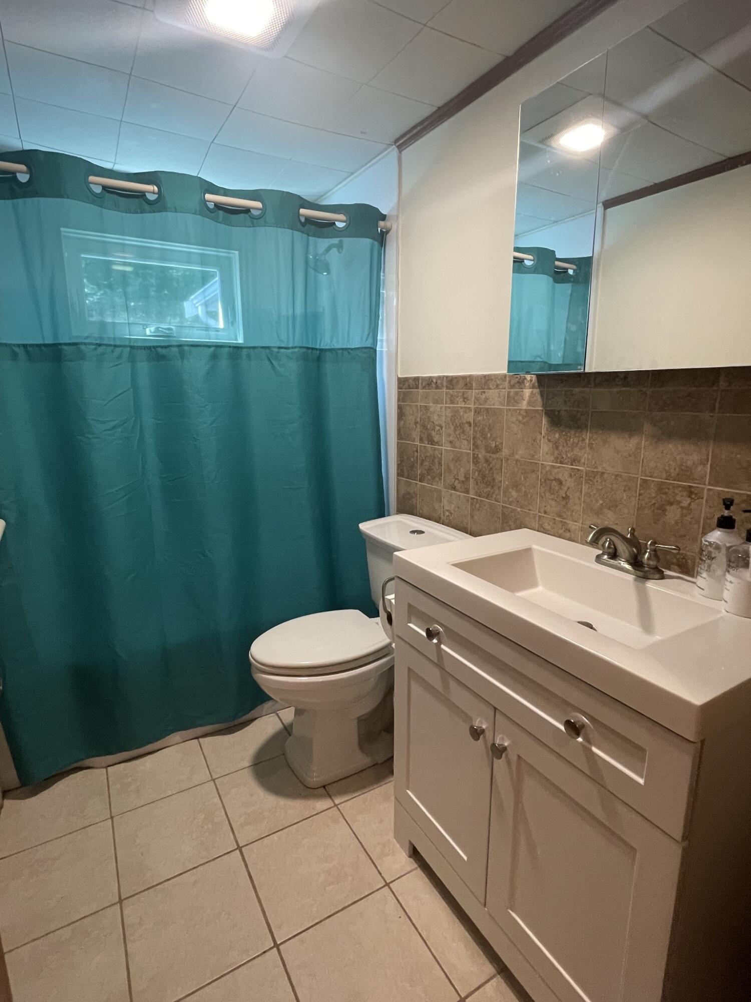 358 Strawberry Hill Road Centerville, MA 02632 - Photo 10 of 11 a view of bathroom with a toilet and a sink