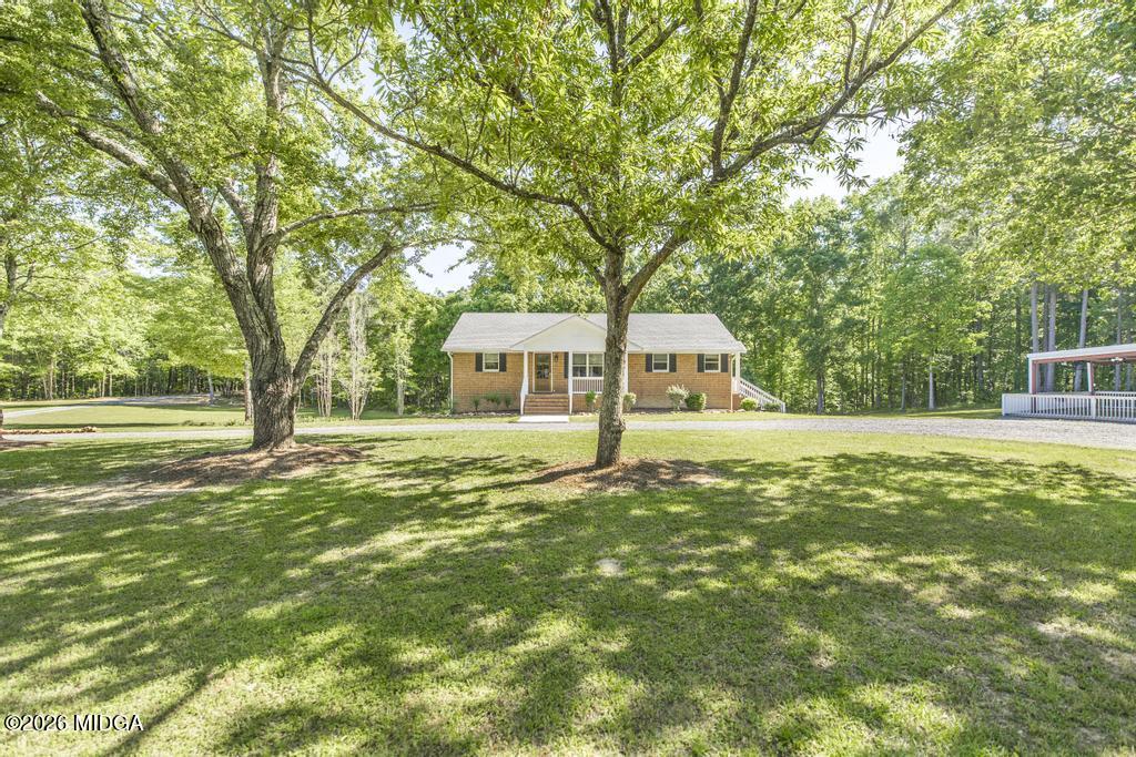 3365 Highway 80 Roberta, GA 31078 - Photo 2 of 41 a front view of a house with a yard
