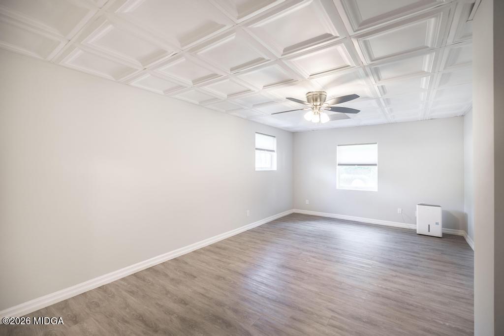 3365 Highway 80 Roberta, GA 31078 - Photo 25 of 41 a view of an empty room with a window and wooden floor