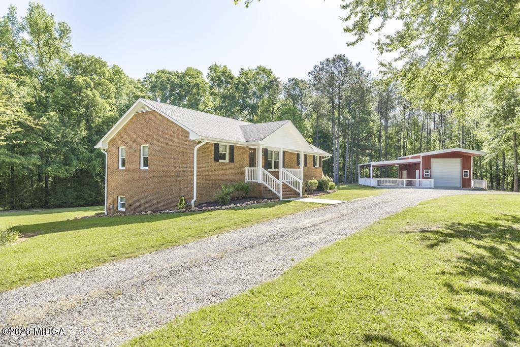 3365 Highway 80 Roberta, GA 31078 - Photo 3 of 41 a view of a house with a yard and sitting area