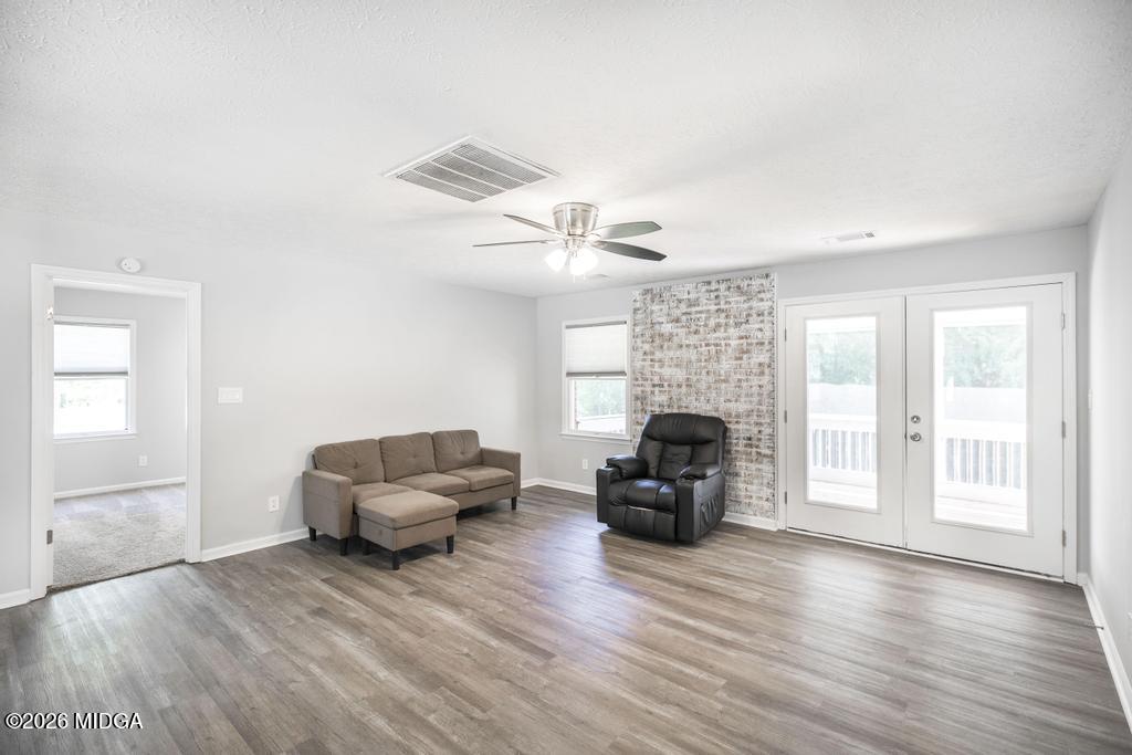 3365 Highway 80 Roberta, GA 31078 - Photo 8 of 41 a living room with furniture and a fireplace