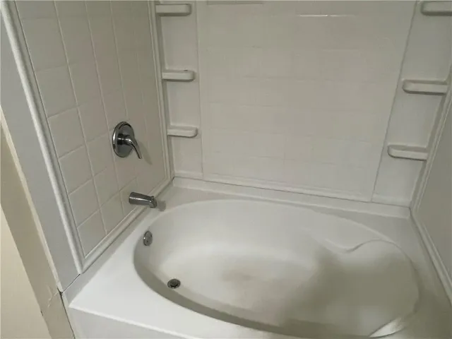 a bathroom with a white bath tub