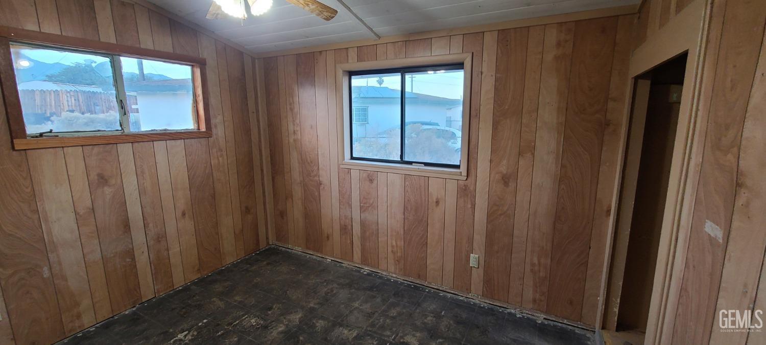 Undisclosed Address Trona, CA 93562 - Photo 19 of 27 a view of an empty room with wooden floor and windows