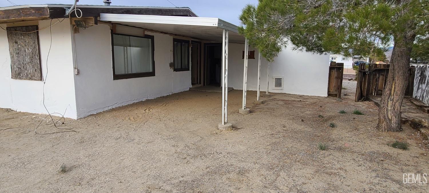 Undisclosed Address Trona, CA 93562 - Photo 4 of 27 a view of a house with a tree