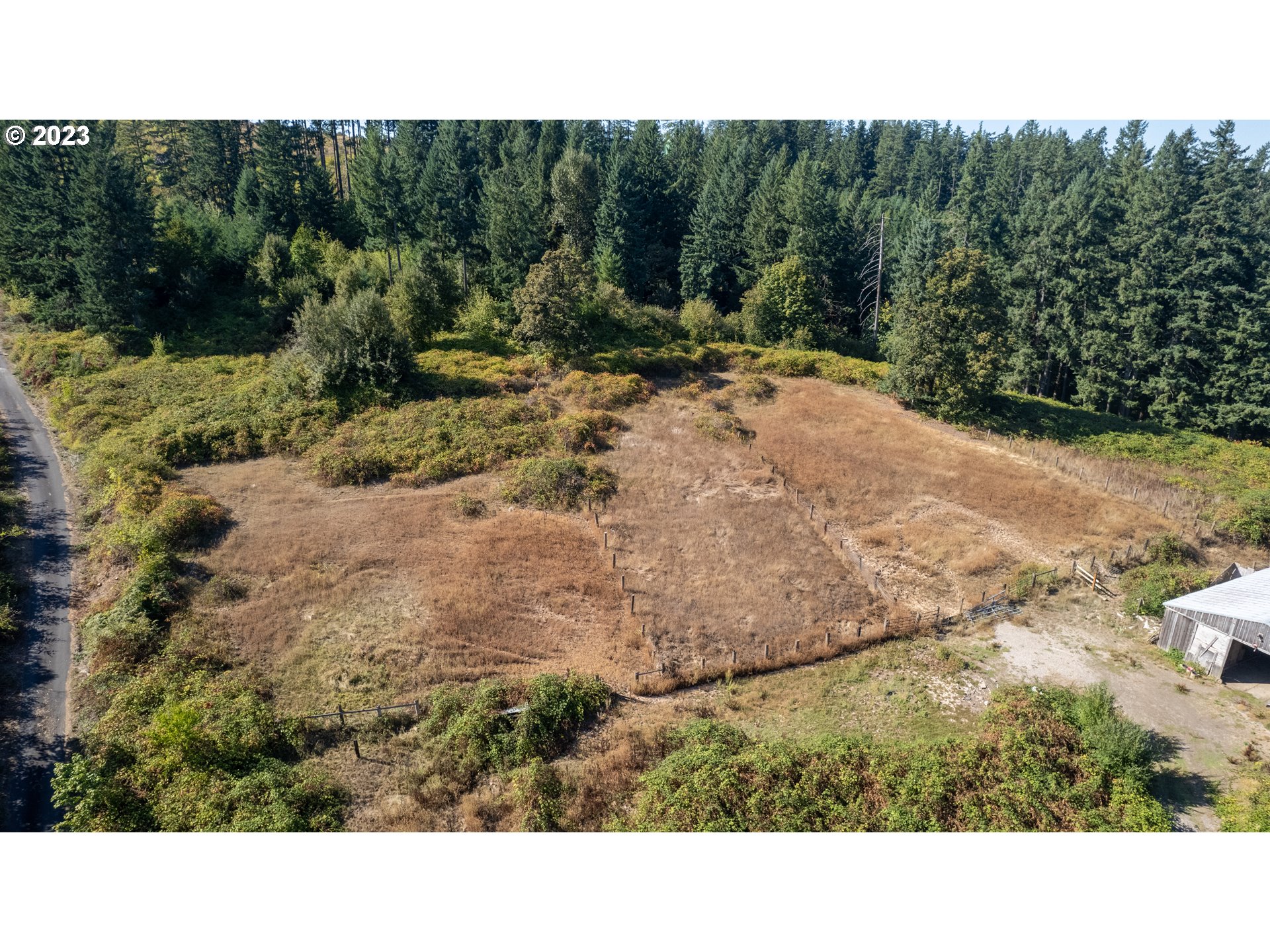 16913 South Hattan Road Oregon City, OR 97045 - Photo 11 of 44 a open area with trees in the background