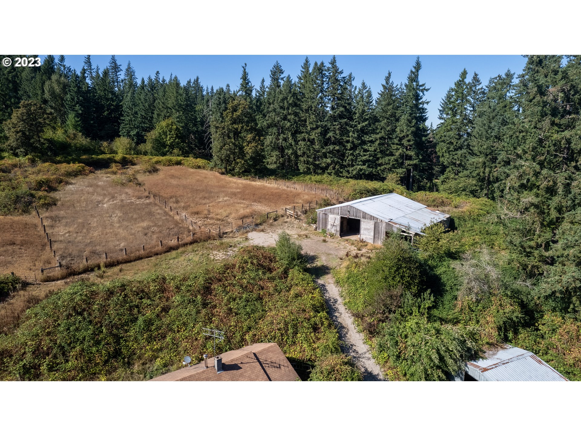 16913 South Hattan Road Oregon City, OR 97045 - Photo 12 of 44 a view of a field of grass and trees
