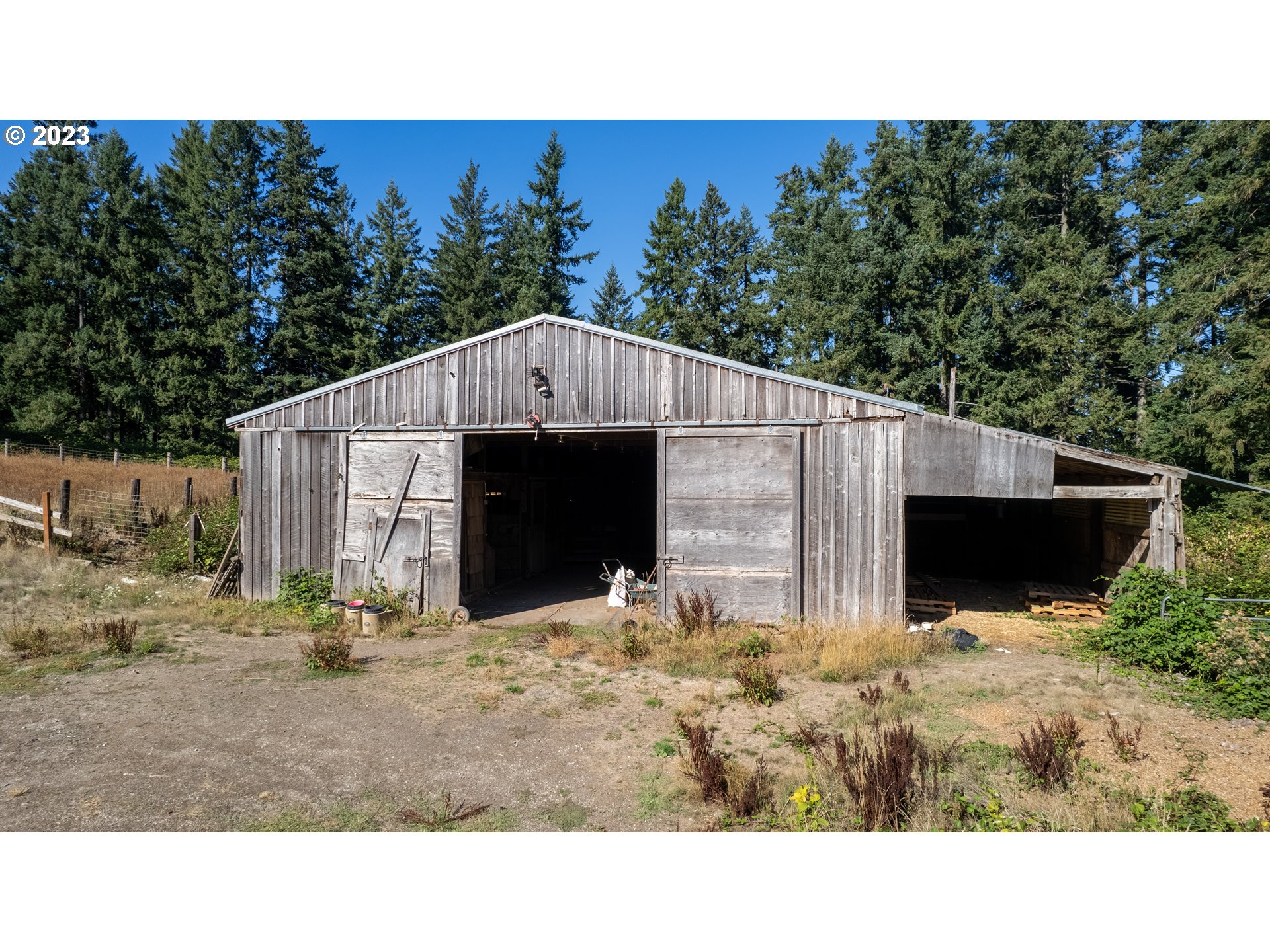 16913 South Hattan Road Oregon City, OR 97045 - Photo 15 of 44 a view of house with yard and trees in the background