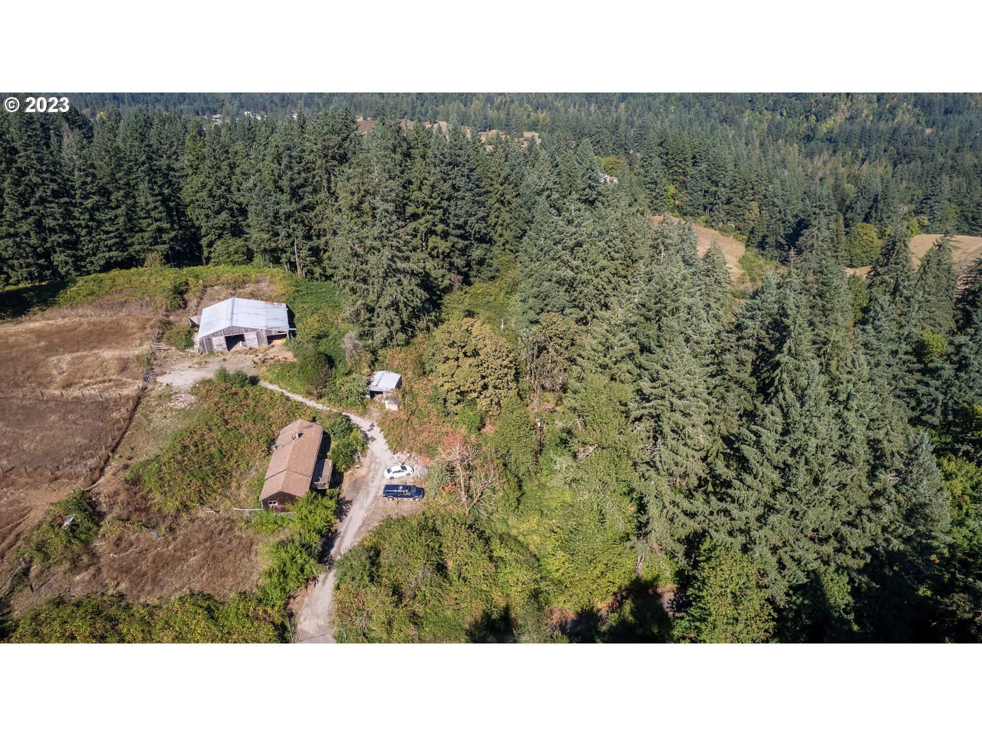 16913 South Hattan Road Oregon City, OR 97045 - Photo 2 of 44 a bathroom with a sink and mirror