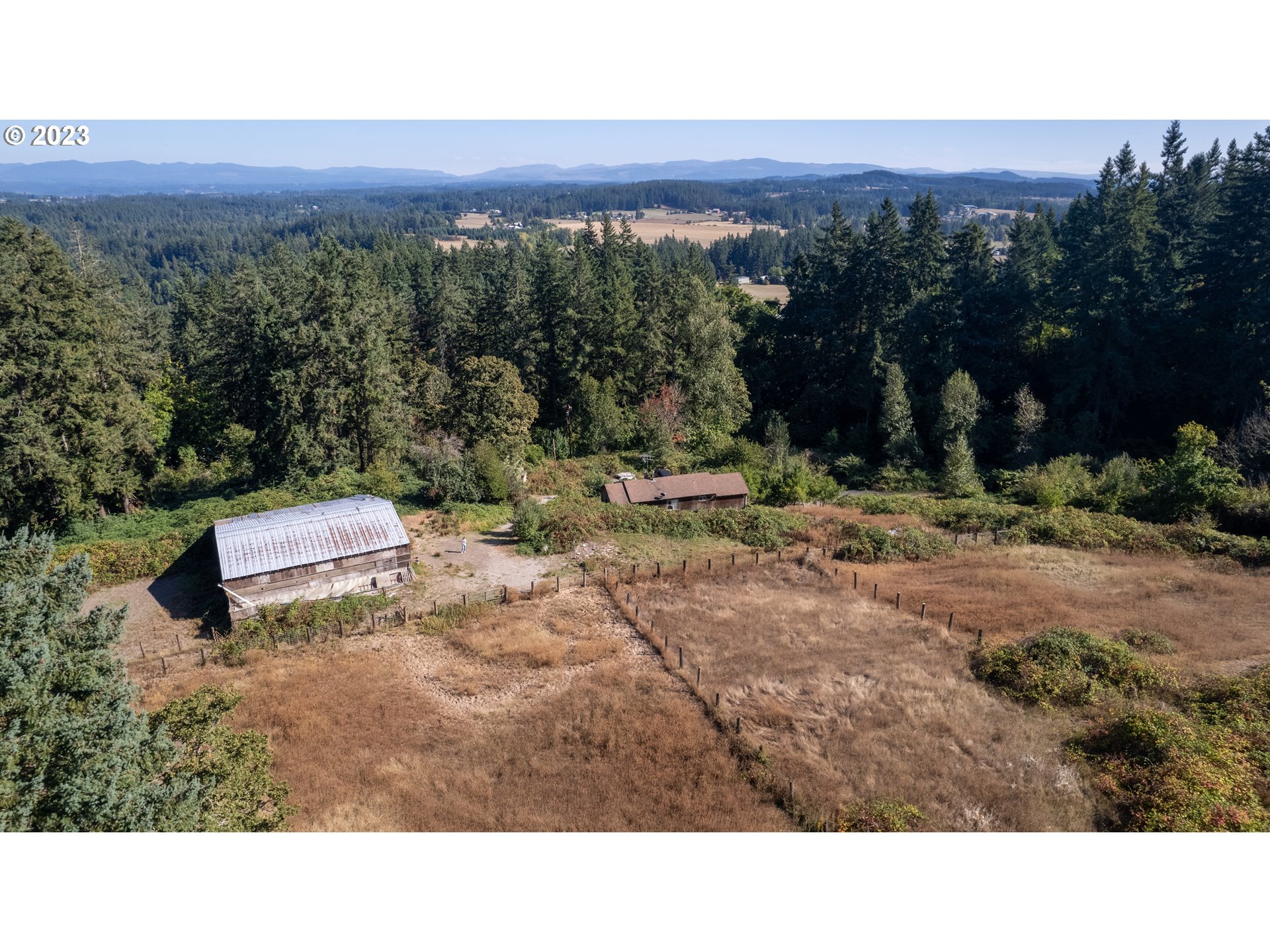 16913 South Hattan Road Oregon City, OR 97045 - Photo 23 of 44 a black and white photo of a forest