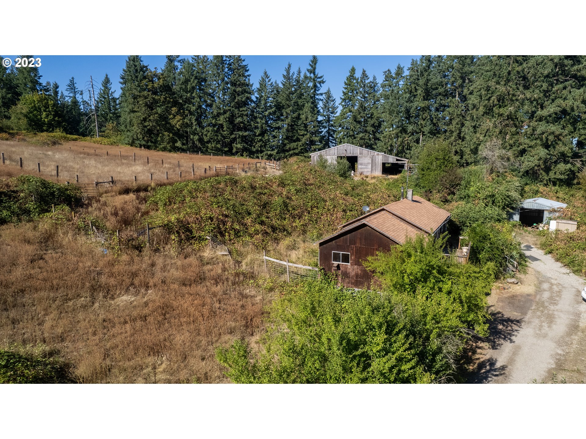 16913 South Hattan Road Oregon City, OR 97045 - Photo 25 of 44 a view of a house with a yard