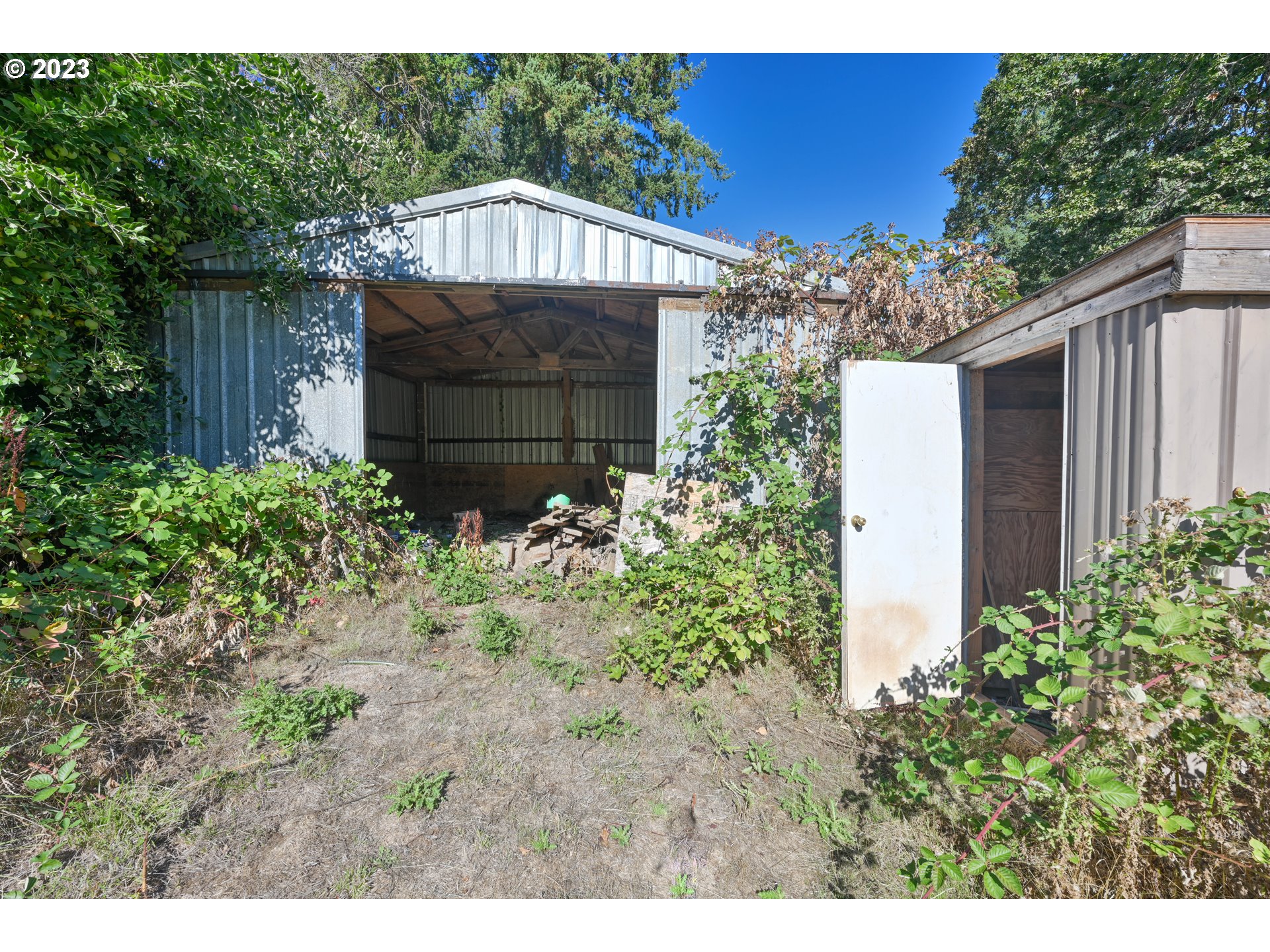 16913 South Hattan Road Oregon City, OR 97045 - Photo 31 of 44 a front view of a house with a yard