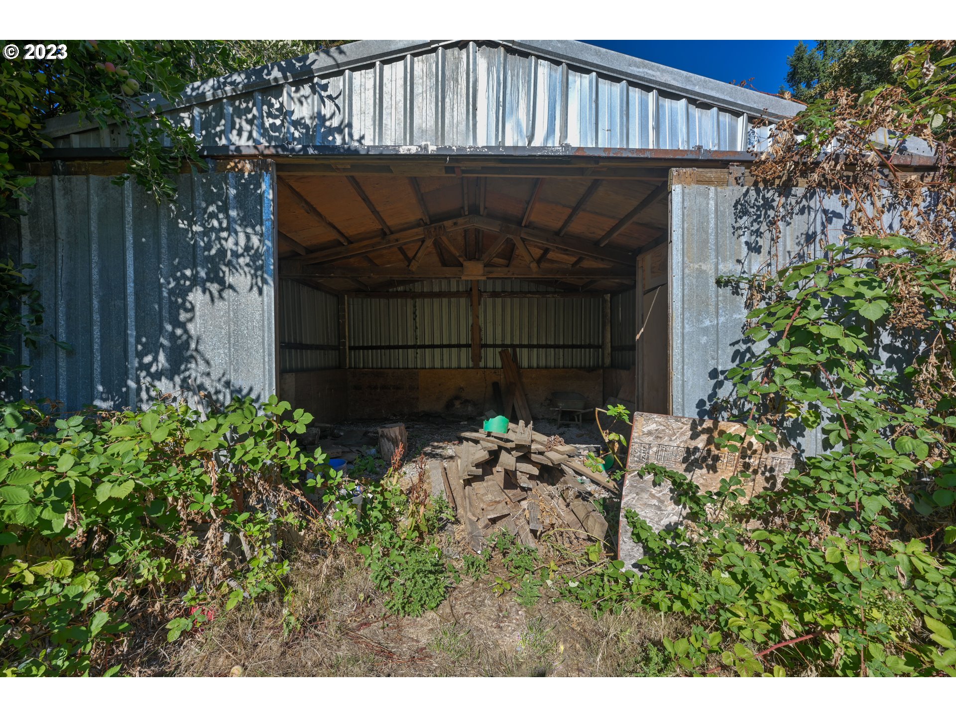 16913 South Hattan Road Oregon City, OR 97045 - Photo 32 of 44 a view of a house with a small yard and wooden fence