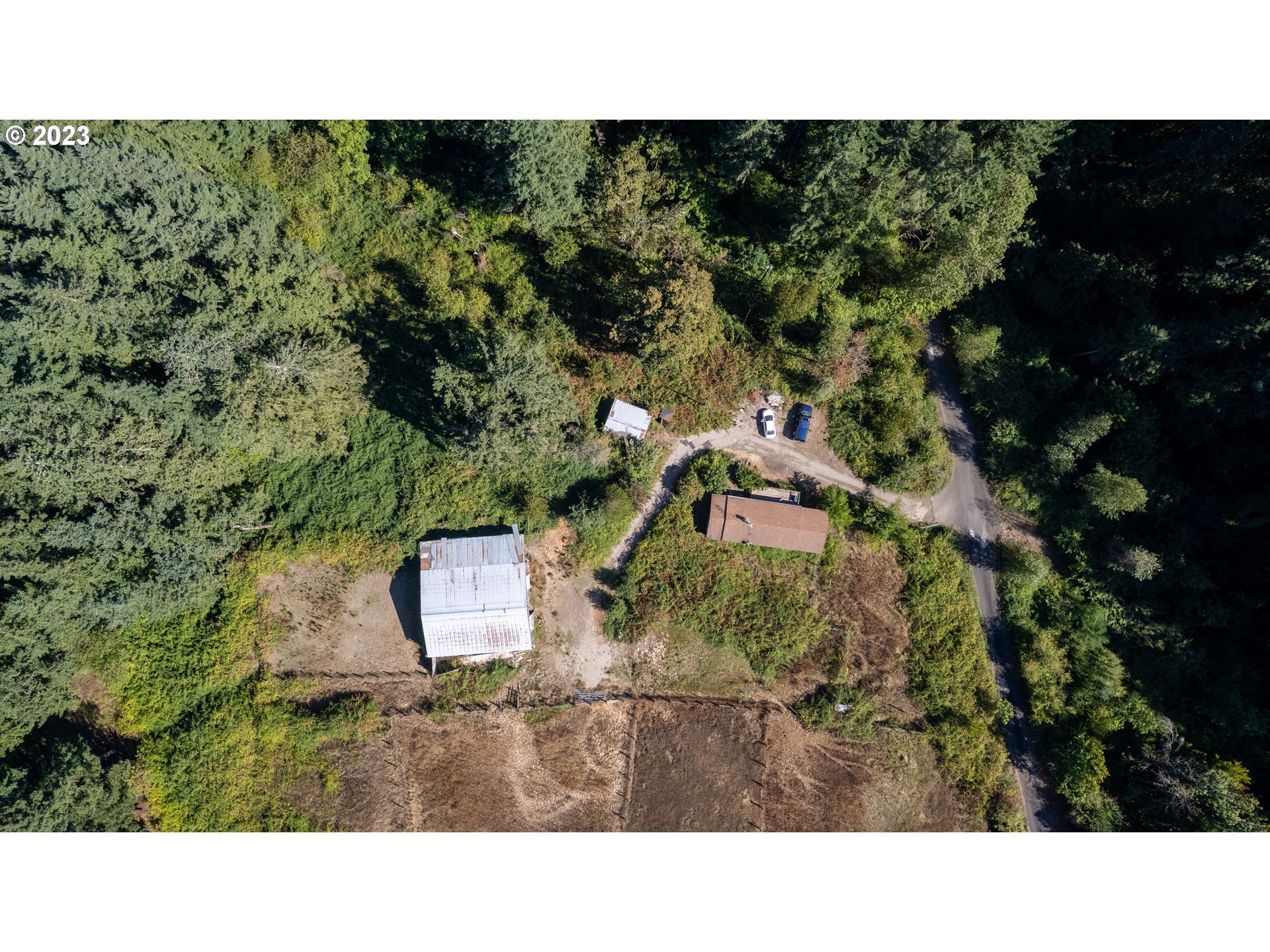 16913 South Hattan Road Oregon City, OR 97045 - Photo 4 of 44 a black and white photo of a house