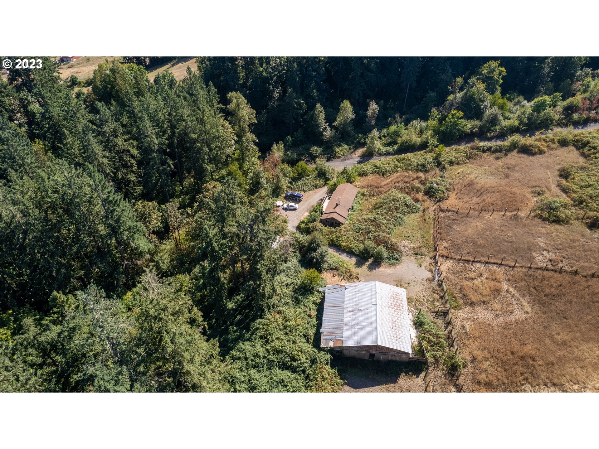 16913 South Hattan Road Oregon City, OR 97045 - Photo 6 of 44 a black and white photo of a house