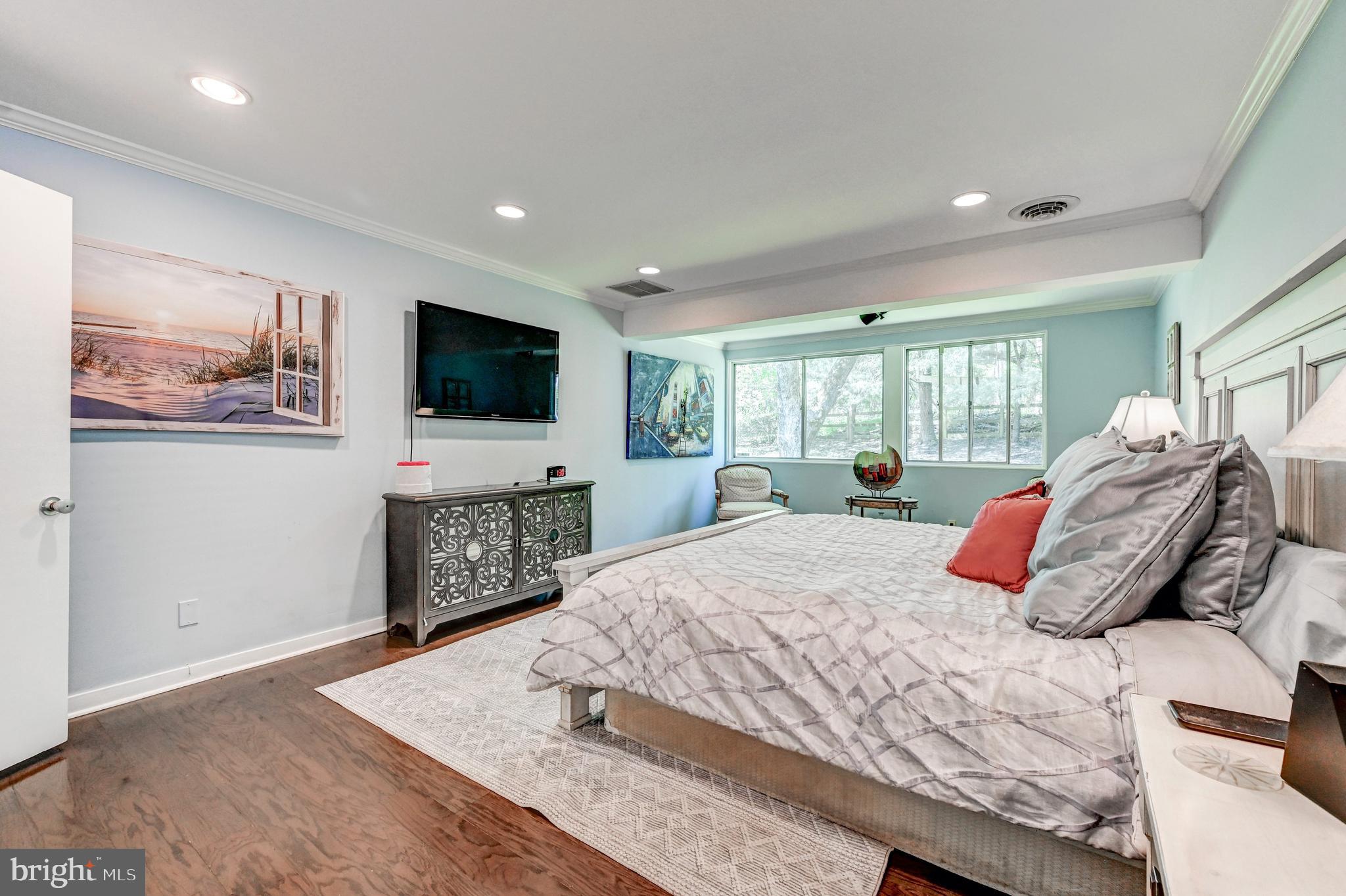 3604 Barberry Court Baltimore, MD 21208 - Photo 25 of 48 a bedroom with a bed and a flat screen television