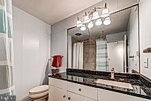 3604 Barberry Court Baltimore, MD 21208 - Photo 30 of 48 a bathroom with a sink and a mirror