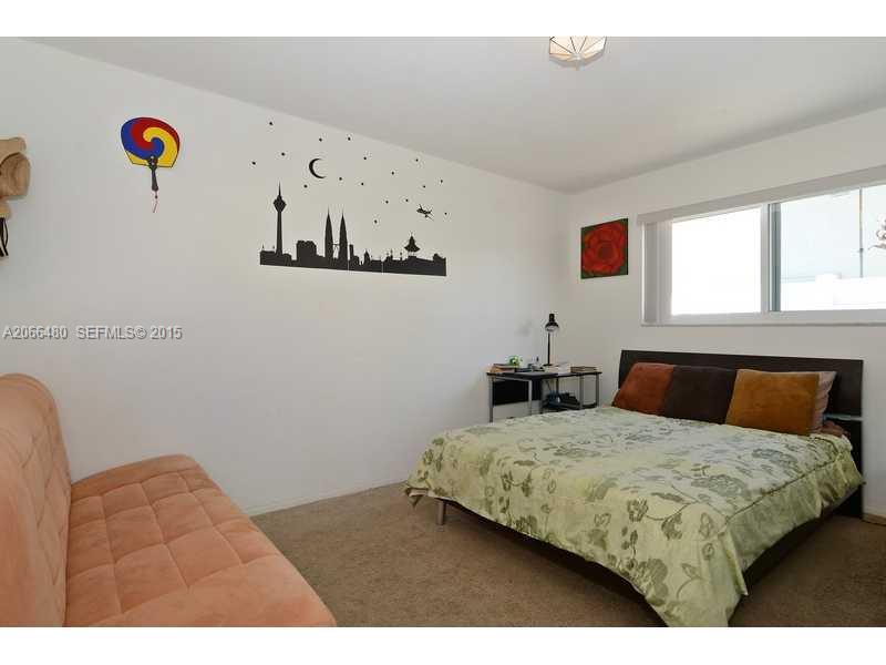 5010 West Park Road Hollywood, FL 33021 - Photo 10 of 16 a bedroom with a bed and window
