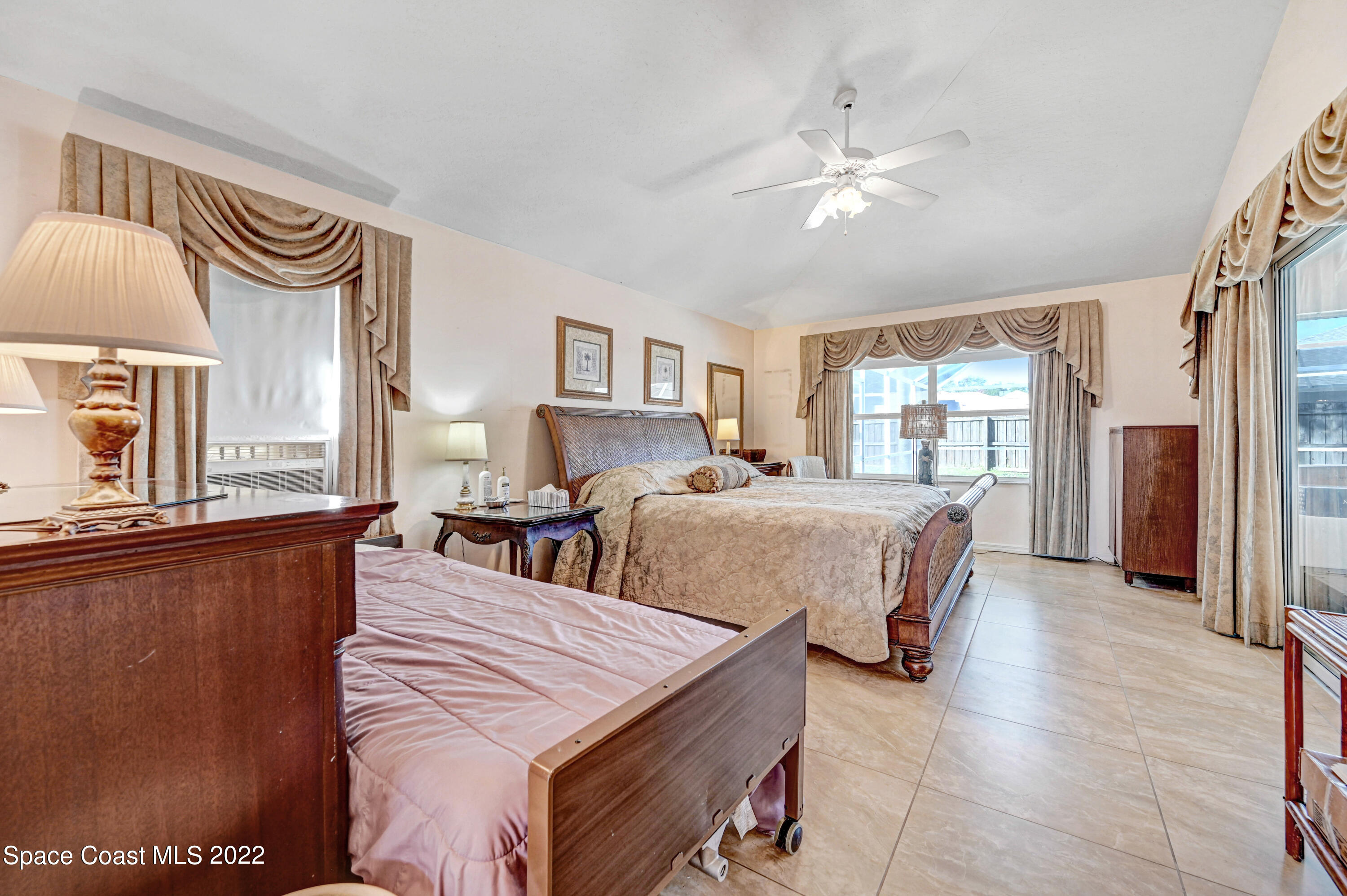 1924 Glen Meadows Circle Melbourne, FL 32935 - Photo 15 of 27 a living room with furniture and a window