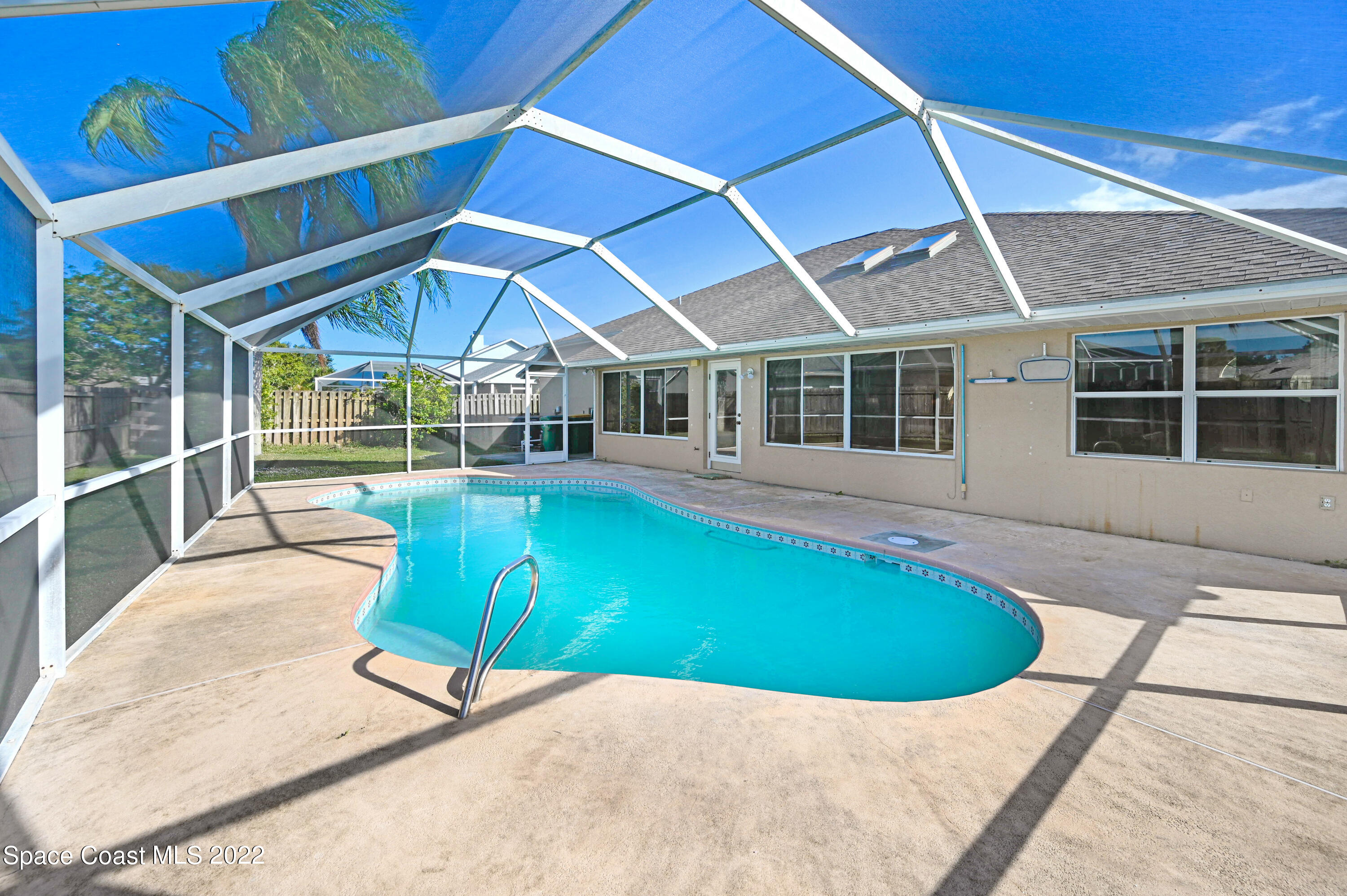 1924 Glen Meadows Circle Melbourne, FL 32935 - Photo 2 of 27 a view of a backyard with swimming pool and porch