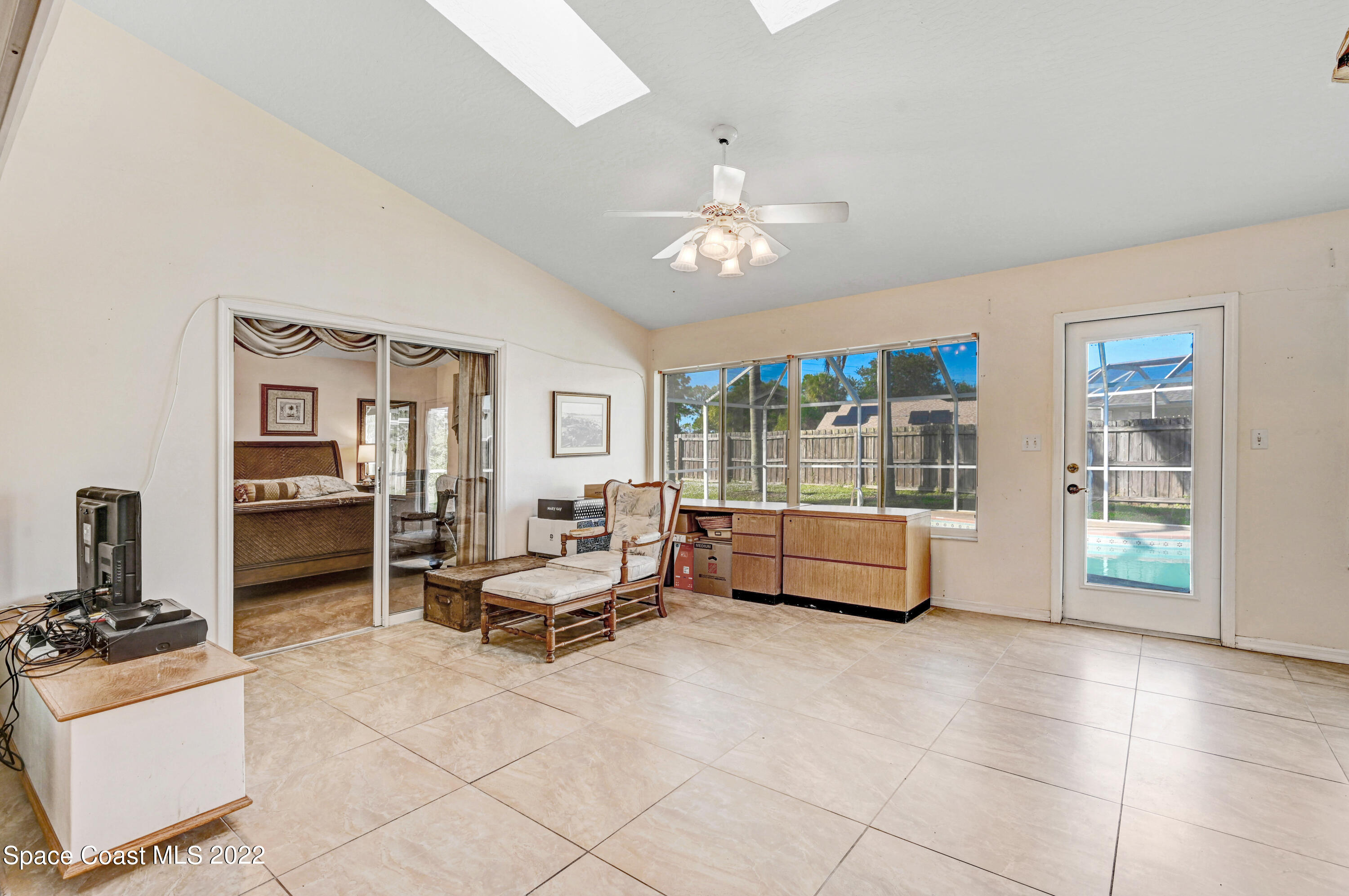 1924 Glen Meadows Circle Melbourne, FL 32935 - Photo 21 of 27 a living room with furniture and a large window