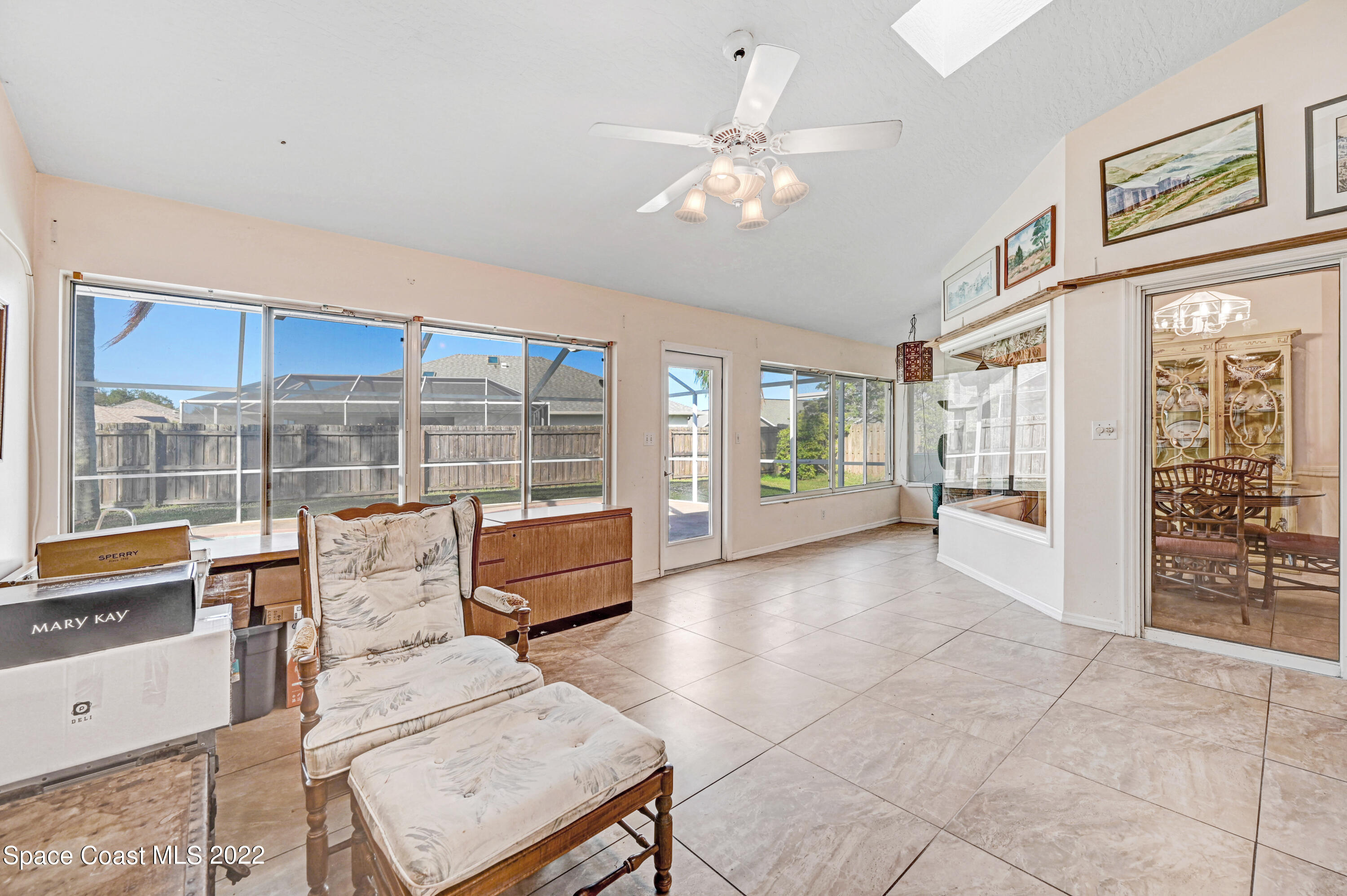 1924 Glen Meadows Circle Melbourne, FL 32935 - Photo 22 of 27 a living room with furniture and large windows