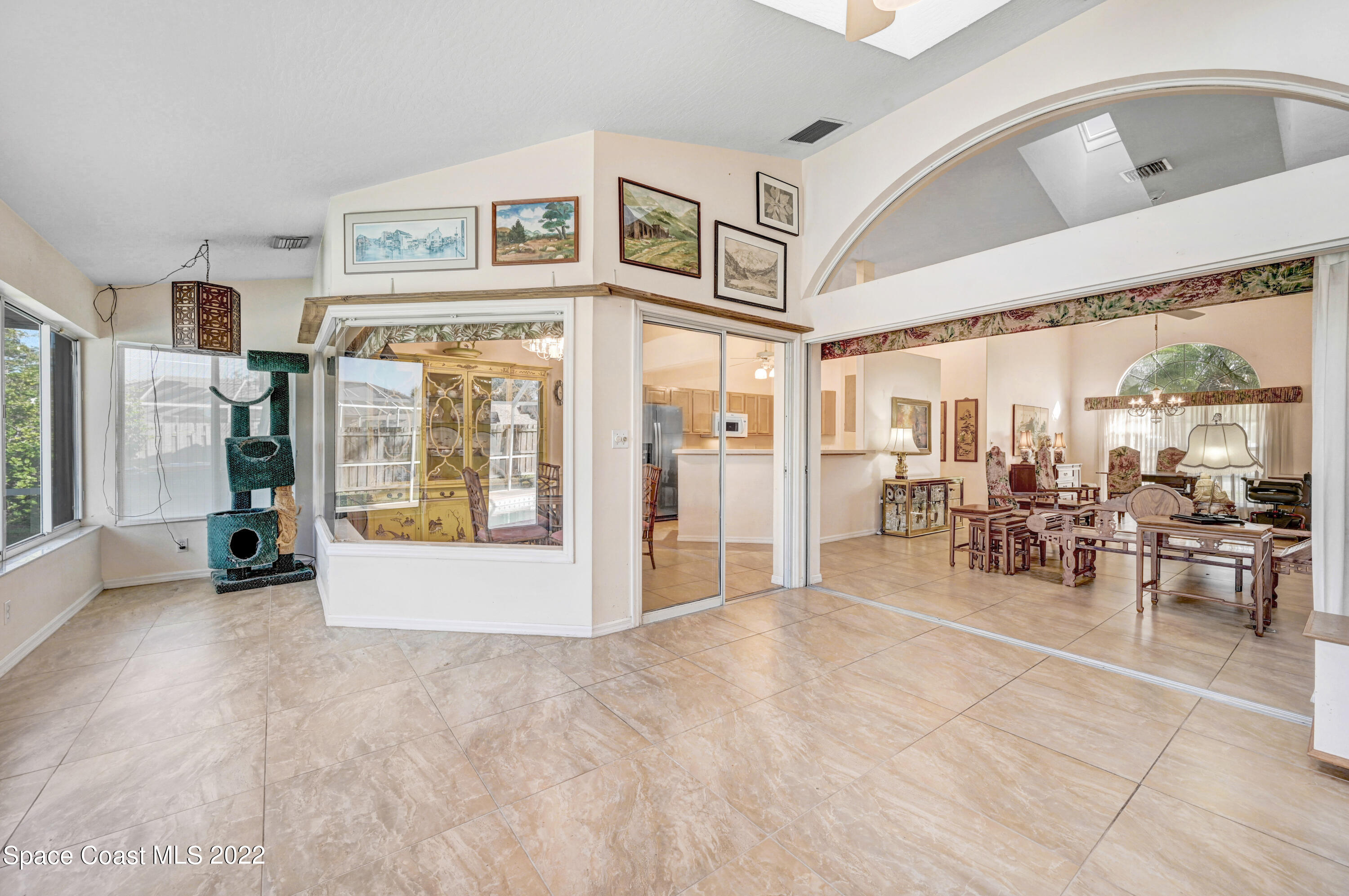 1924 Glen Meadows Circle Melbourne, FL 32935 - Photo 23 of 27 a view of a livingroom with furniture and large window