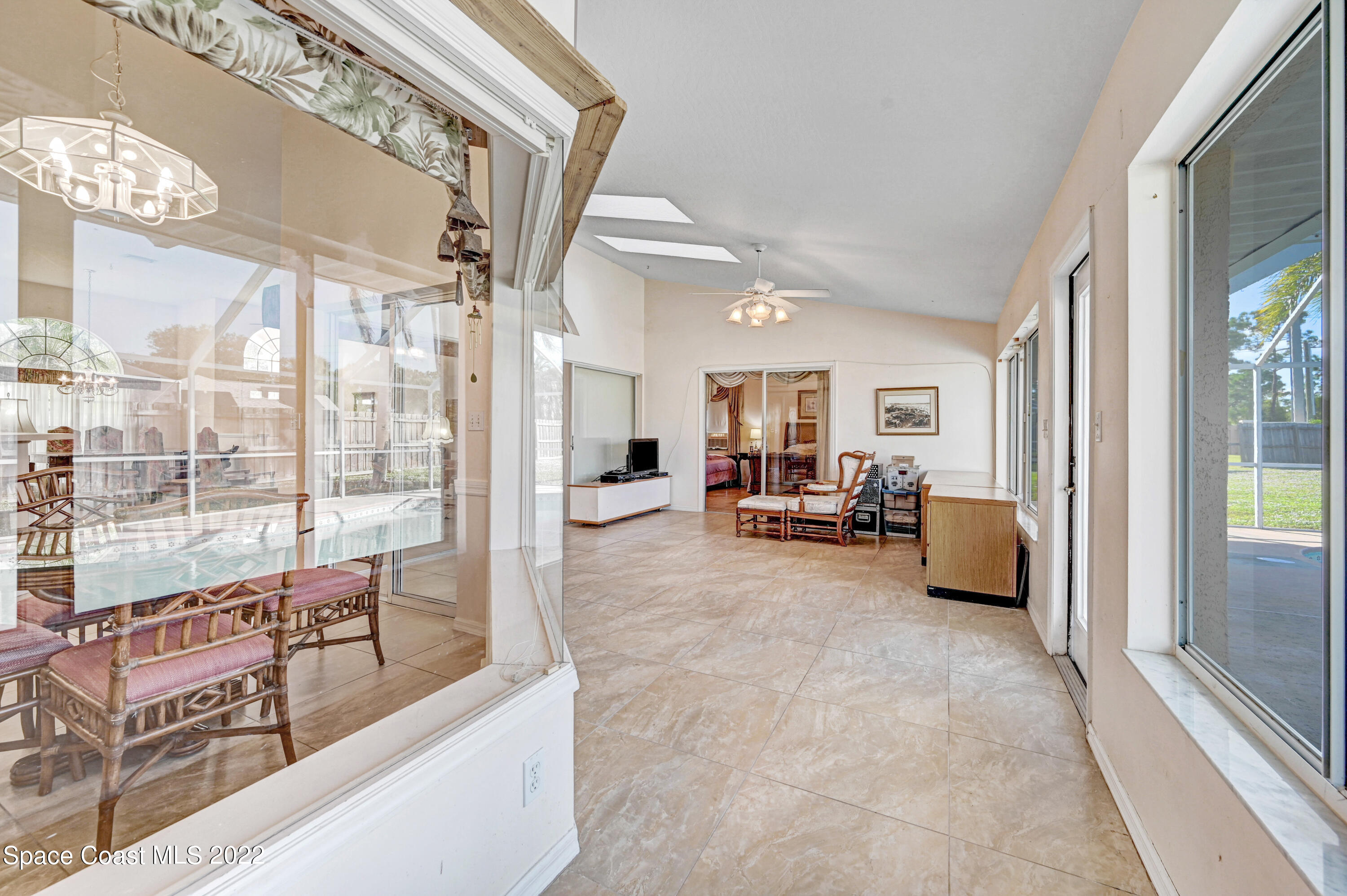 1924 Glen Meadows Circle Melbourne, FL 32935 - Photo 24 of 27 a living room with furniture and a large window