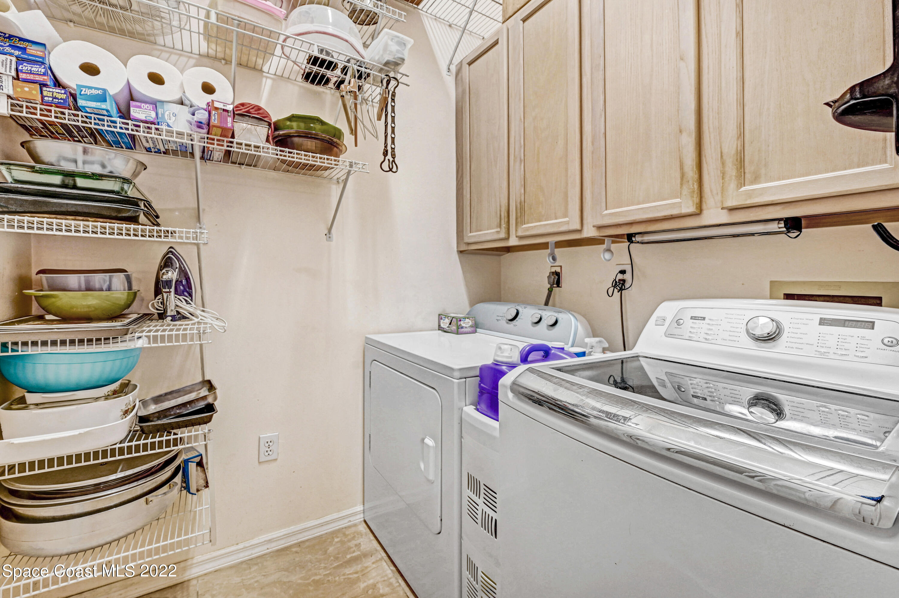 1924 Glen Meadows Circle Melbourne, FL 32935 - Photo 25 of 27 a utility room with dryer and washer