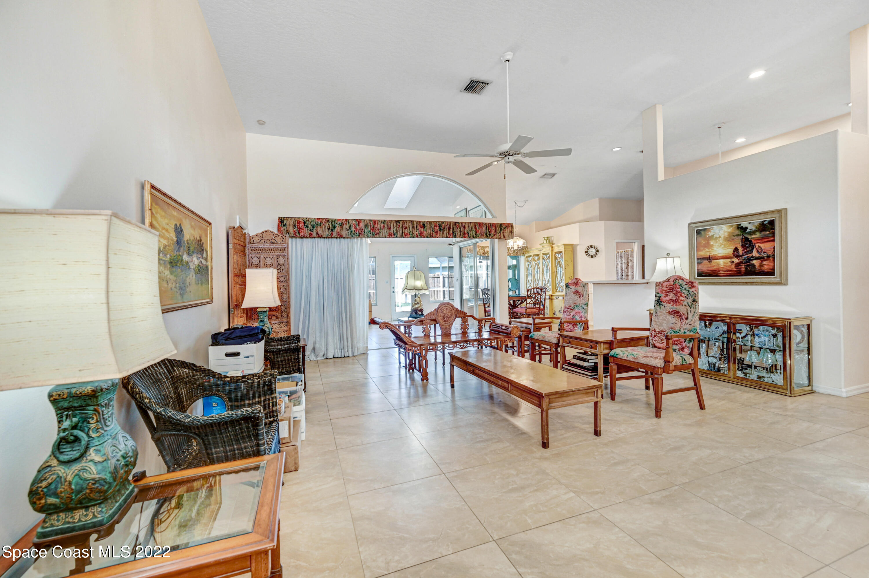 1924 Glen Meadows Circle Melbourne, FL 32935 - Photo 4 of 27 a living room with furniture and a flat screen tv