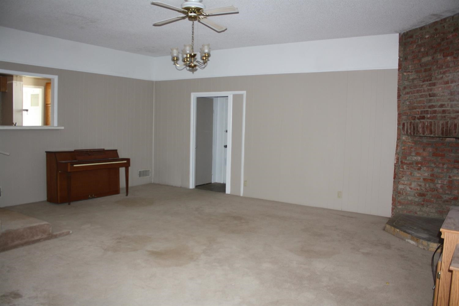 306 West 34th Plainview, TX 79072 - Photo 15 of 36 a view of an empty room with a chandelier