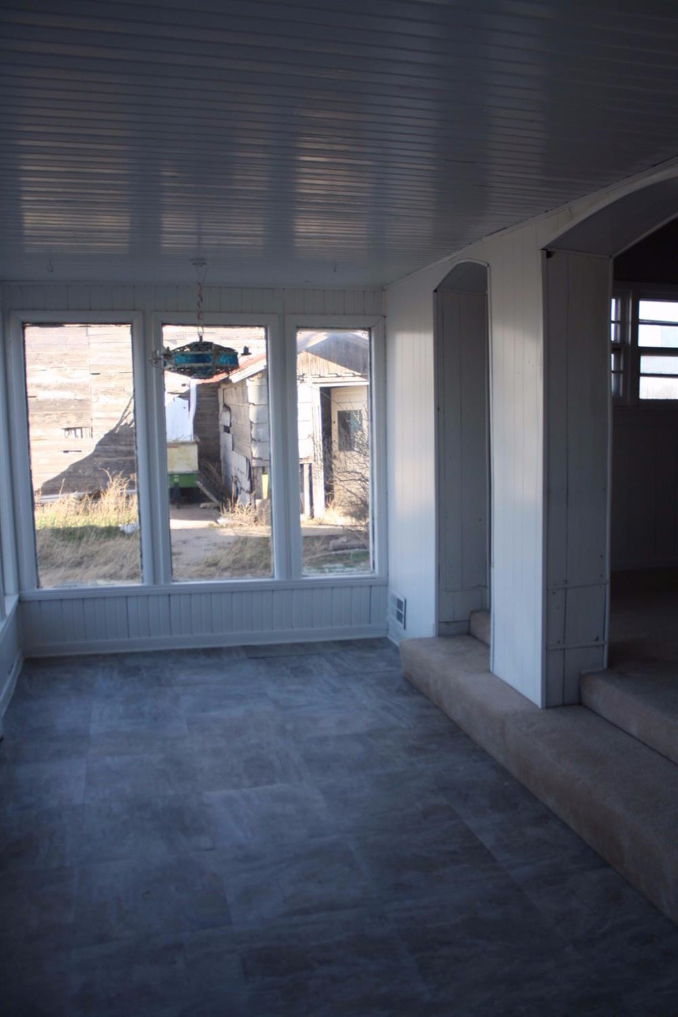 306 West 34th Plainview, TX 79072 - Photo 18 of 36 a view of a big room with wooden floor and windows