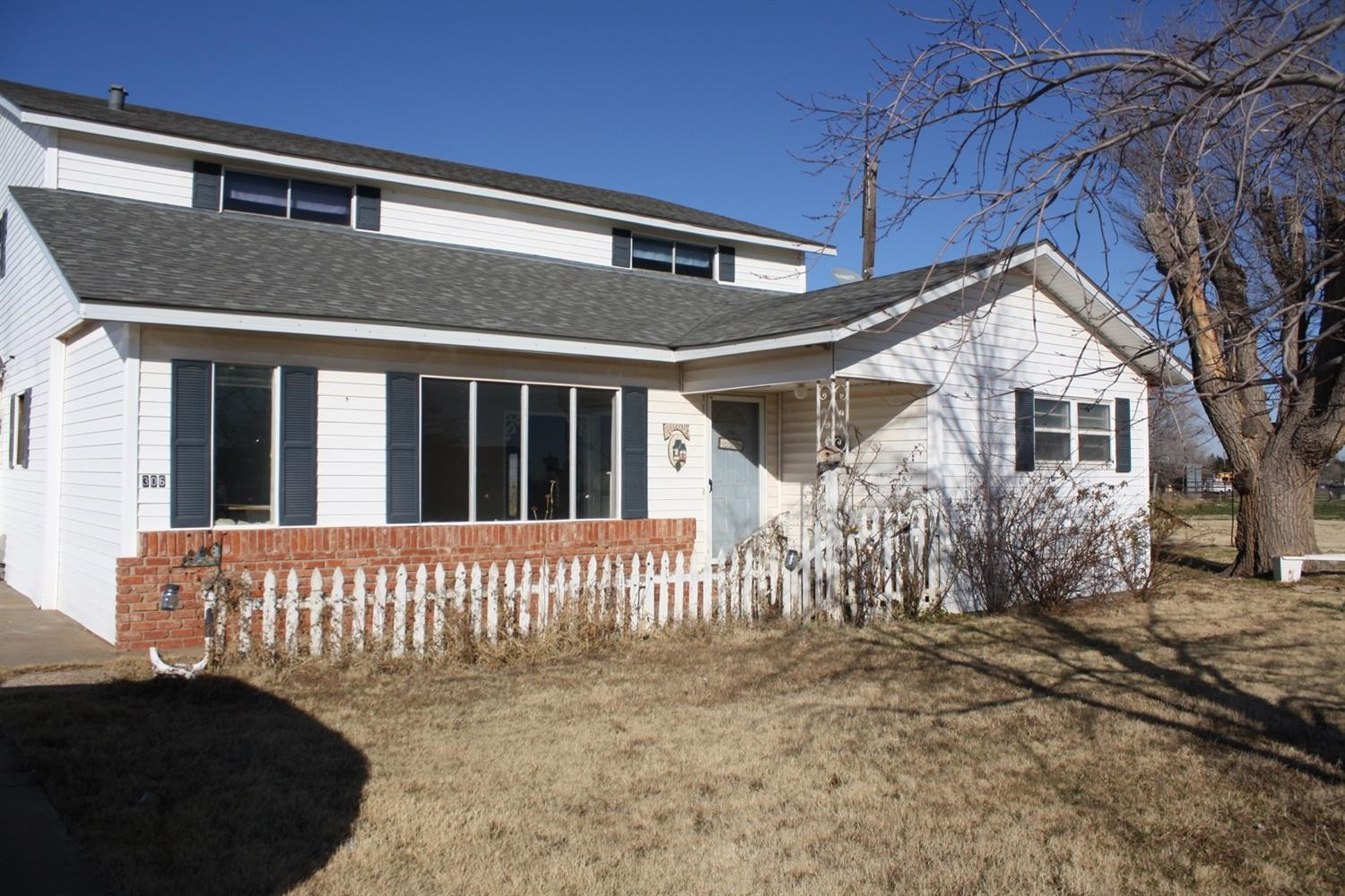 306 West 34th Plainview, TX 79072 - Photo 2 of 36 a front view of a house with a yard
