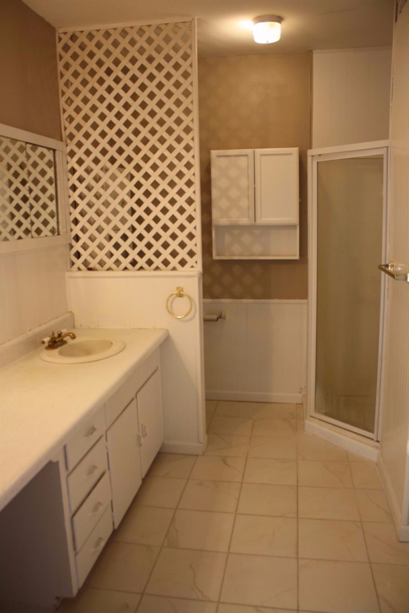 306 West 34th Plainview, TX 79072 - Photo 21 of 36 a bathroom with a sink and a shower
