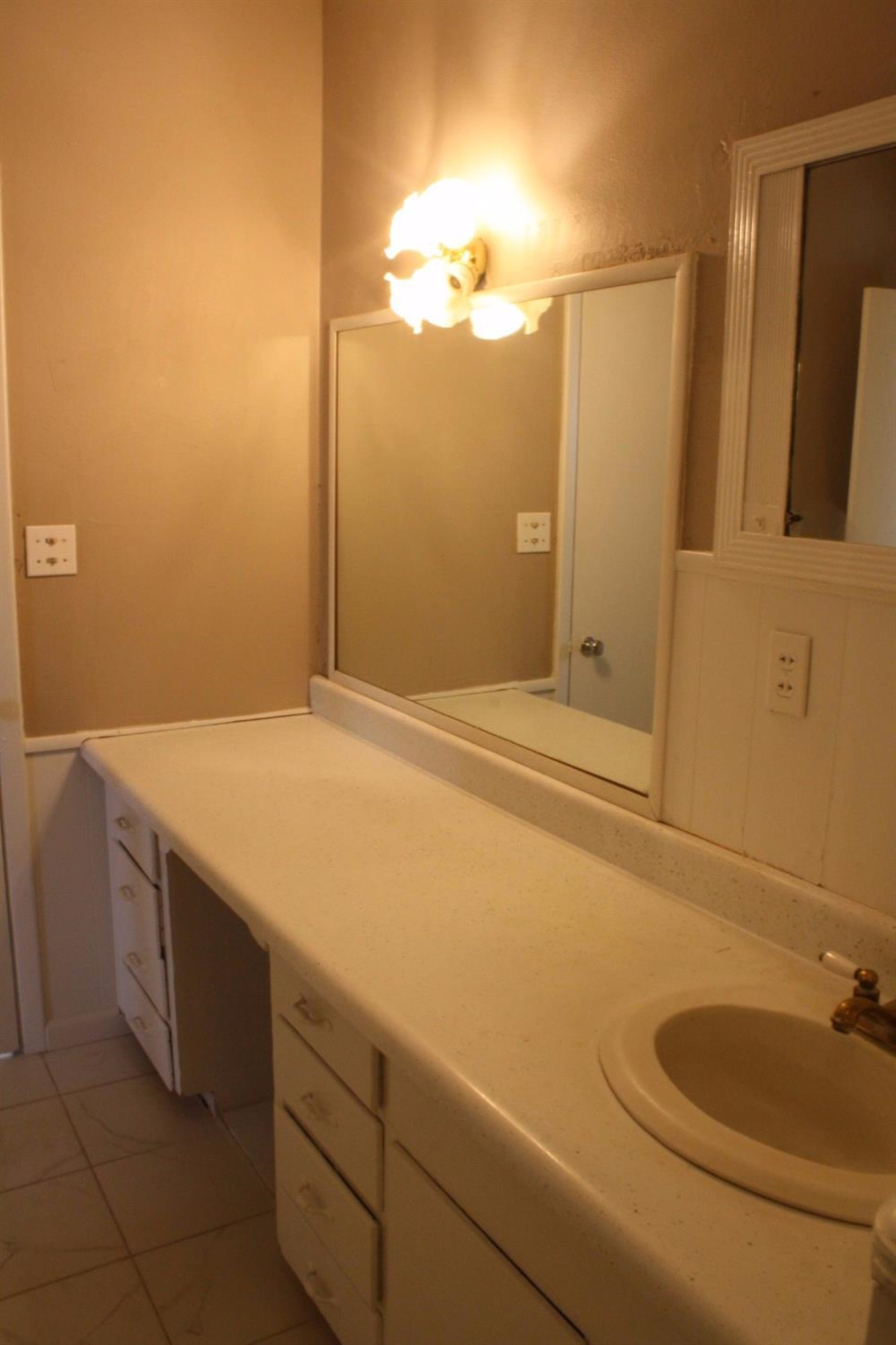 306 West 34th Plainview, TX 79072 - Photo 22 of 36 a bathroom with a sink and a mirror