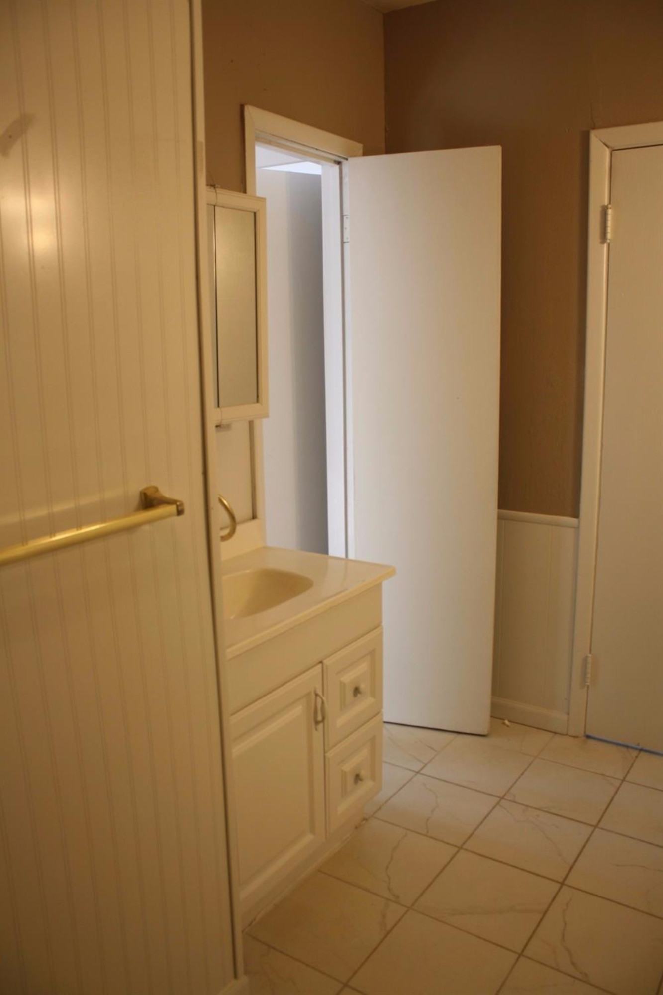 306 West 34th Plainview, TX 79072 - Photo 23 of 36 a bathroom with a shower and a sink