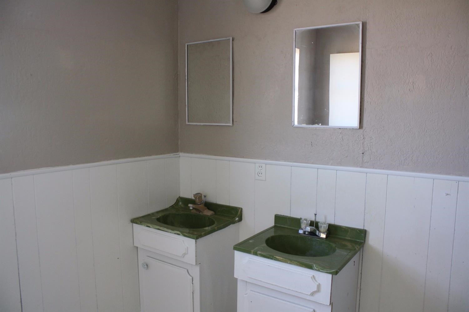 306 West 34th Plainview, TX 79072 - Photo 28 of 36 a kitchen with a sink and cabinets