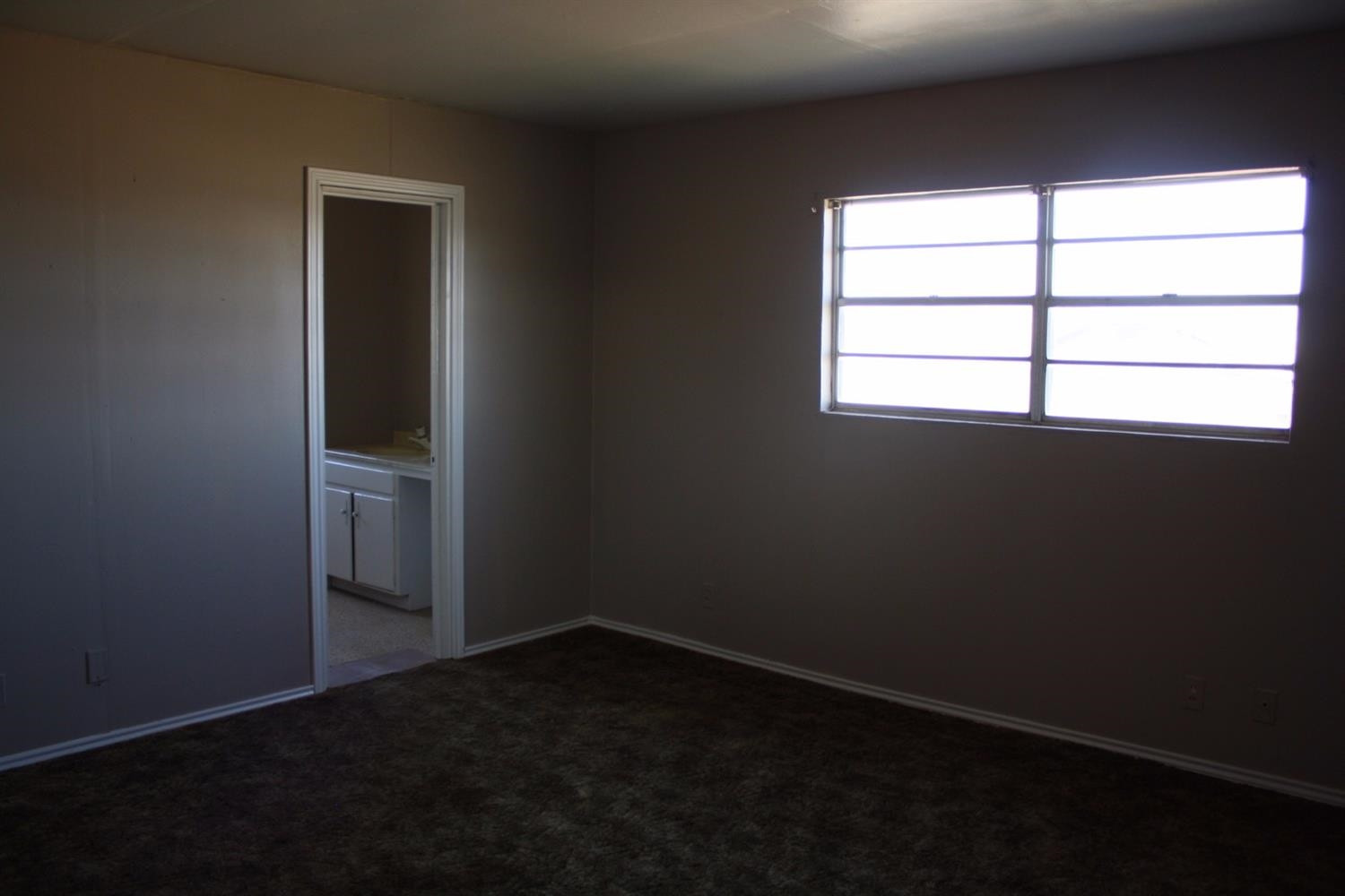 306 West 34th Plainview, TX 79072 - Photo 30 of 36 an empty room with a empty space and window