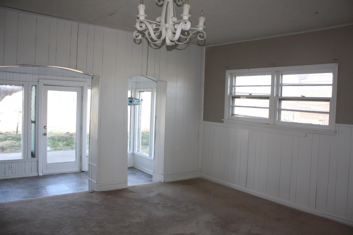 306 West 34th Plainview, TX 79072 - Photo 7 of 36 wooden floor in an empty room with a window