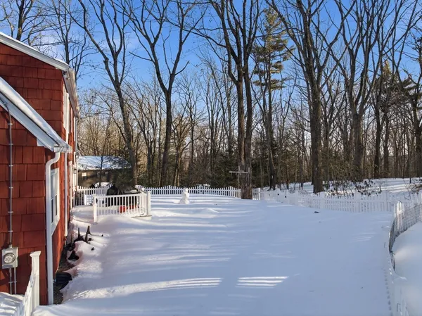 a view of multiple houses with a yard