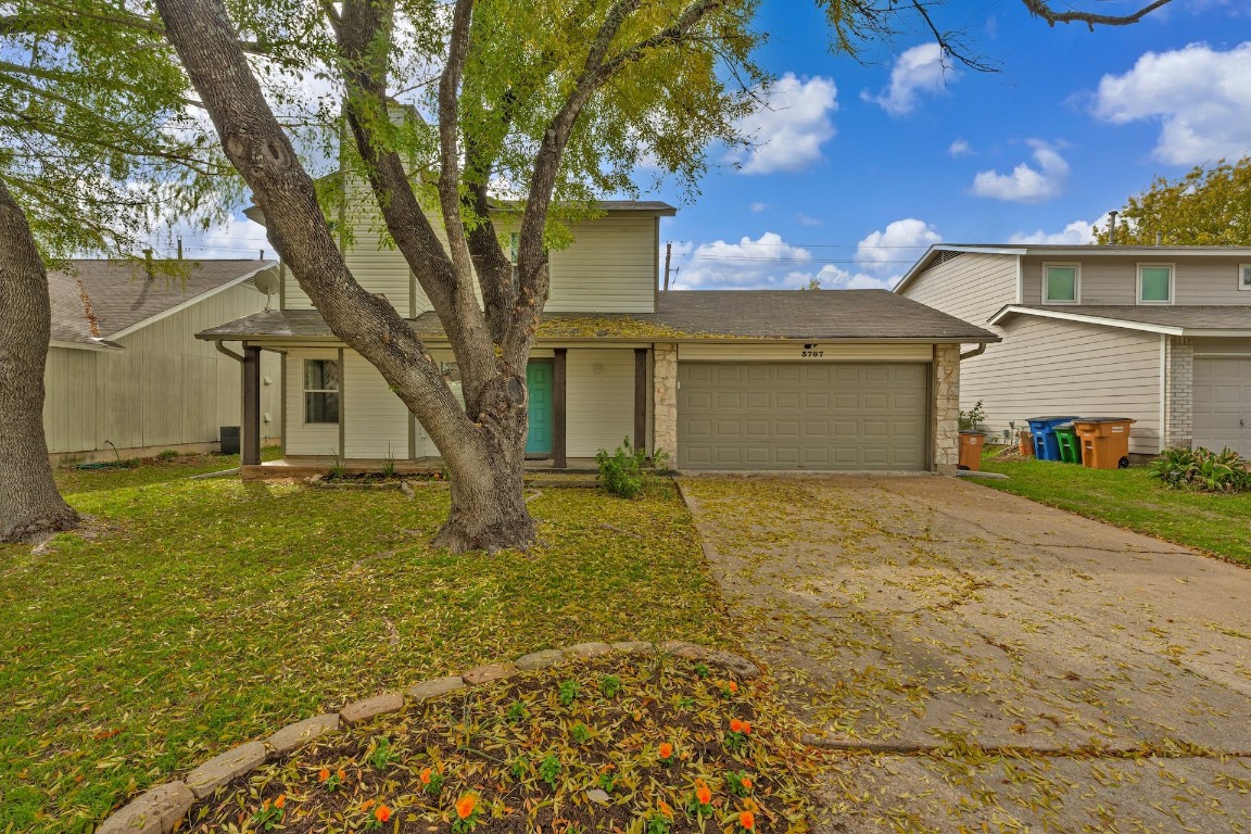 3707 Counselor Drive Austin, TX 78745 - Photo 1 of 1 front view of a house with a yard