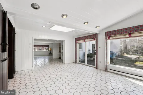 a view of a livingroom with a furniture and closet